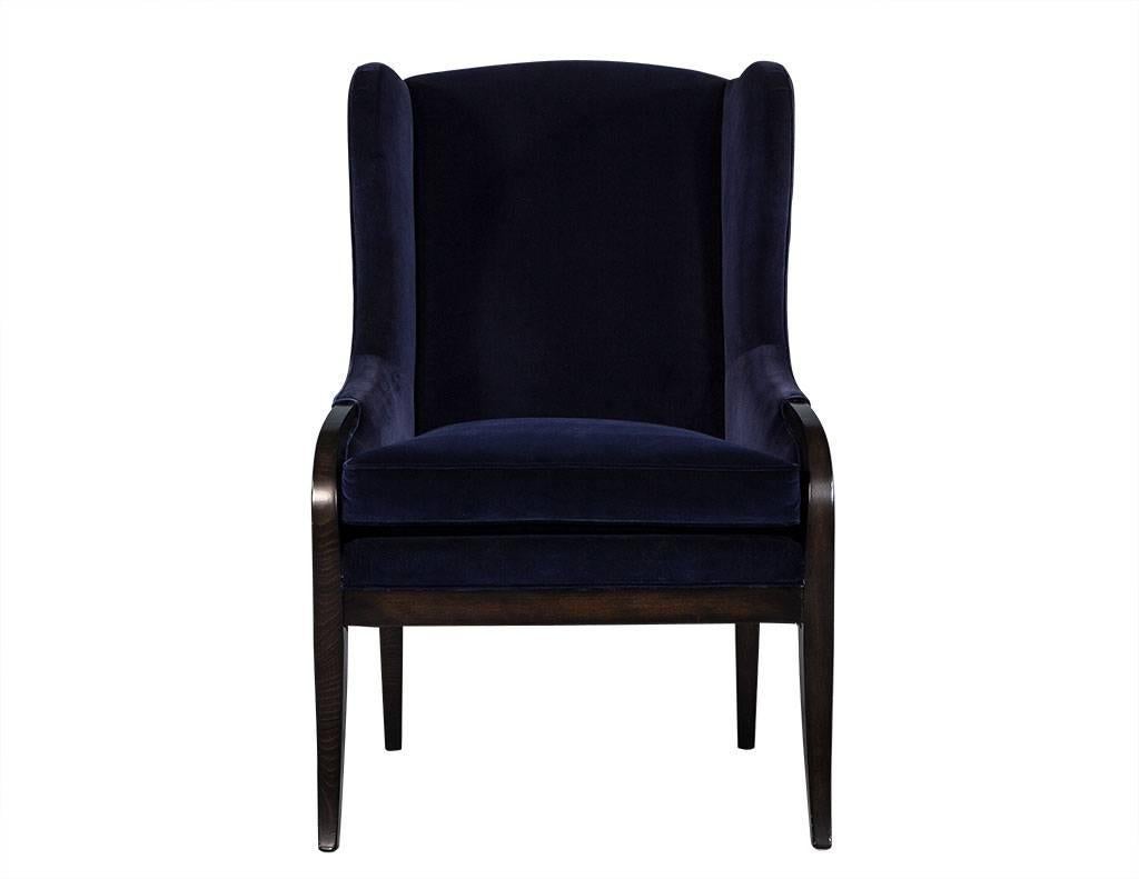 These transitional style chairs are smartly designed and crafted. The frames are made of espresso-stained show wood and upholstered in a deep navy blue velvet. These wing back chairs truly embodies comfort and flair and the perfect contrast for any
