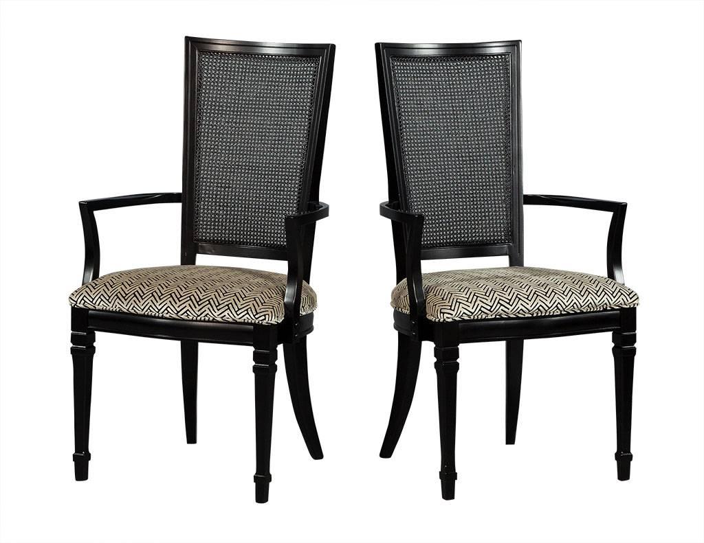 These Louis XVI style dining chairs are chic and sophisticated. Crafted out of solid black walnut, this set of six are excellently restored. The set includes two arm chairs and four regular, and truly adds endless character to your dining room!