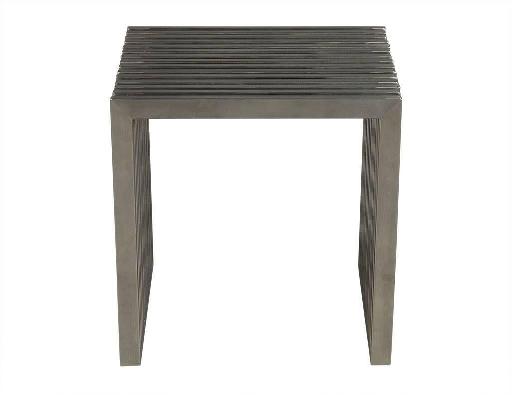 This Modern side table hails from China. It doubles as a three sided metal stool with u-shaped side sections and two rows of Lucite dividers on the sides. Crafted out of stainless steel, it is a truly unique piece perfect for an ultramodern home!