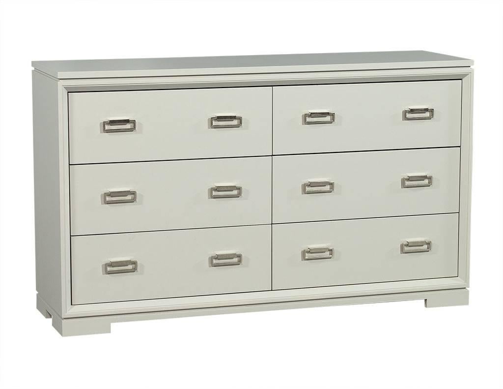 Custom sleek design, fine details made by Carrocel, six under-mount slide self closing walnut drawers with silver rectangular drawer handles. Dresser has a very light grey matte finish. Felt Lined drawers.

This piece can be custom finished with