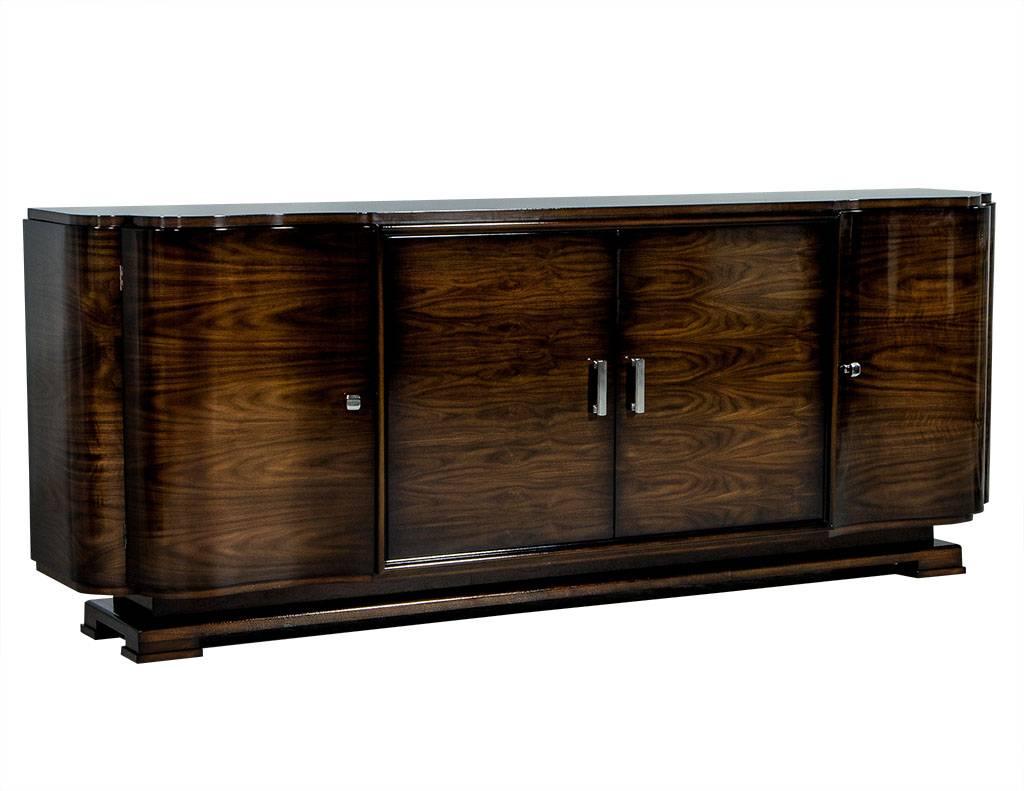 This made to order, Art Deco style buffet is crafted out of solid walnut. It consists of four doors with two shelves in each section. A functional and beautiful piece, perfect for a Classic home. 

This piece is made to order, lead times range