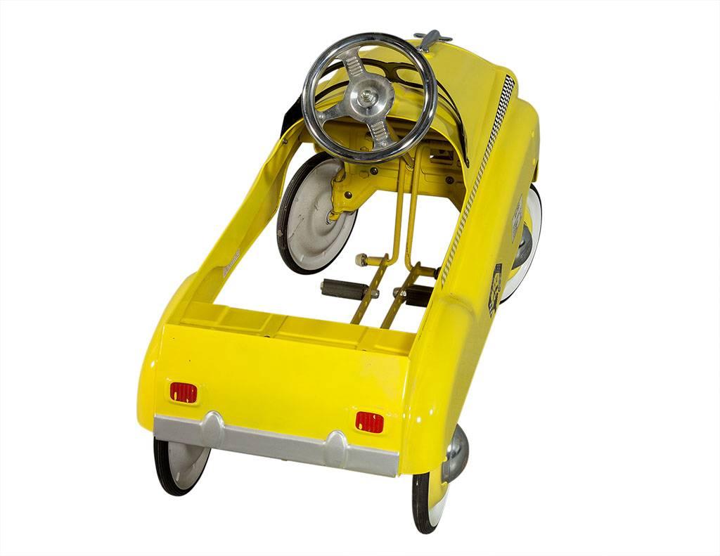 yellow pedal car