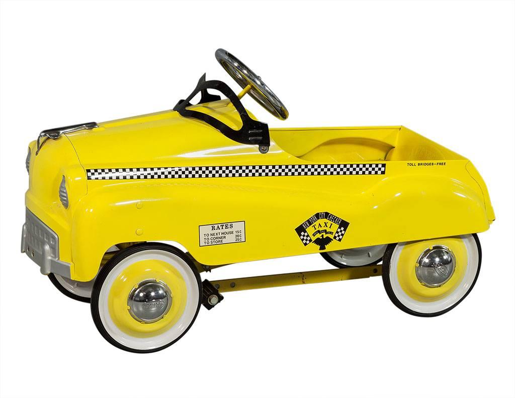 This child’s pedal car is in working order, it is a cool NYC Checker Taxi replica perfect as a gift or décor in a kid’s room!