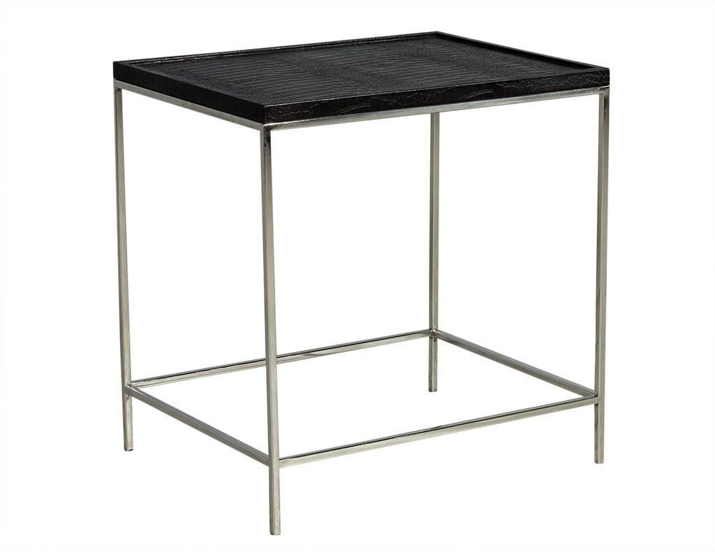 This modern end table has a gorgeous faux alligator patterned leather top and sits atop a thin chrome base and legs.  A sleek piece perfect for a contemporary home!