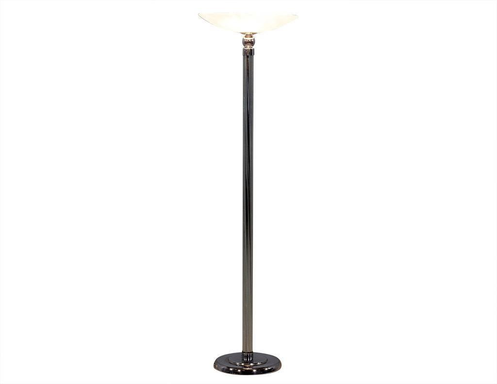 Art Deco floor lamp. Featuring a center column composed of ten glass rods supported by an inner stainless-steel column holding the wiring. The rounded details, stainless steel base and glass shade complete the sophisticated 1960s Art Deco look.