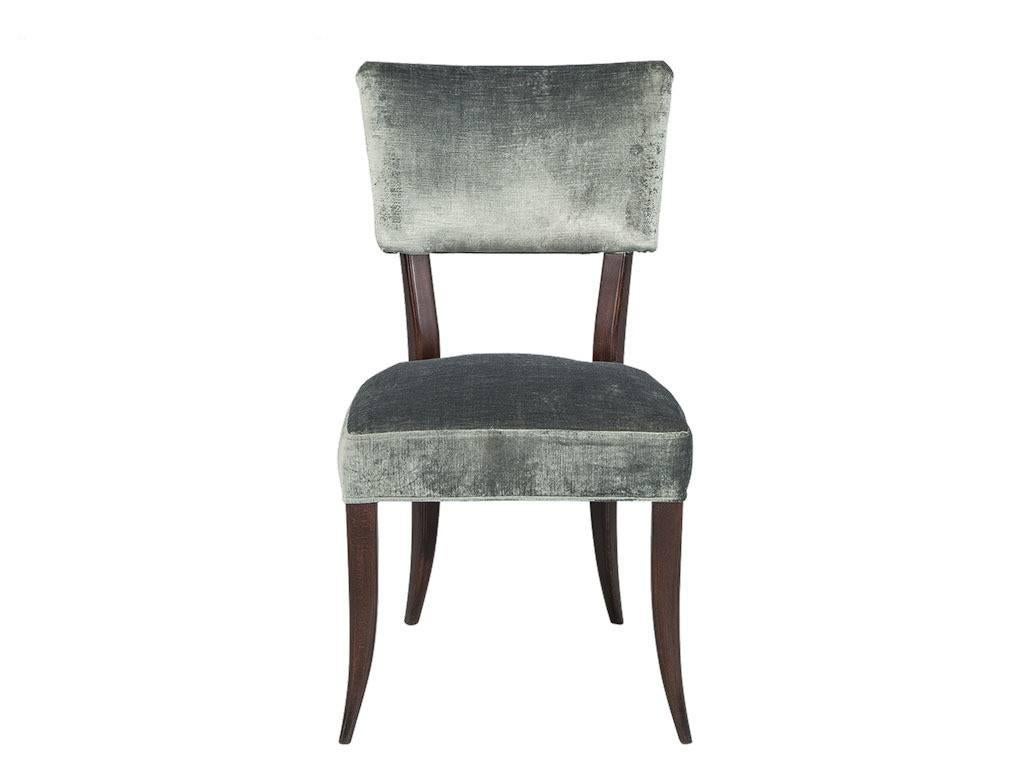 Set of 4, Italian made transitional dining chairs featuring a unique show wood frame with elegant soft curves extending through the heavily tapered leg. Constructed with European beech wood, the frame is strong while remaining light for easy