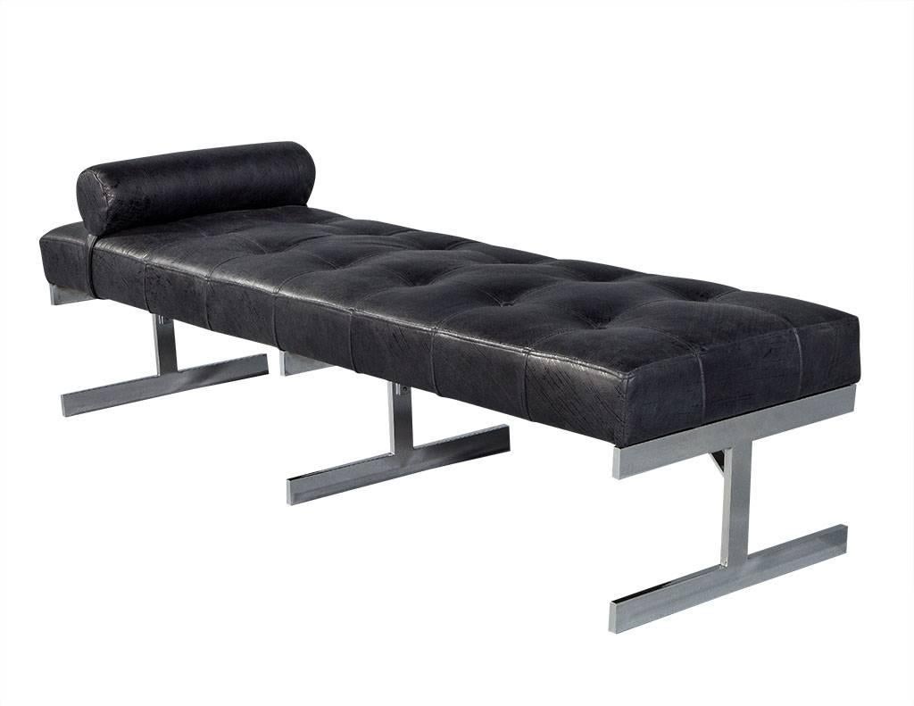 Mid-Century Modern leather daybed custom upholstered in a distressed brushed motif Italian leather. This daybed features three sleek chrome legs and a roll or bolster cushion for comfort and support. A stylish and timeless piece for any interior.