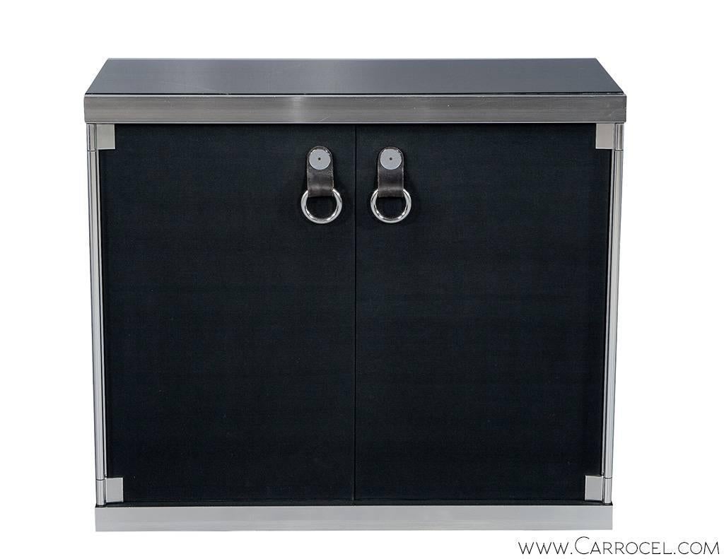 Newly imported from Paris France, Console by Guido Faleschini designed for Hermes, circa 1970s. Uniquely styled and finished in polished stainless with marble top and clad in black velvet. This console chest has trademark door pulls consisting of a