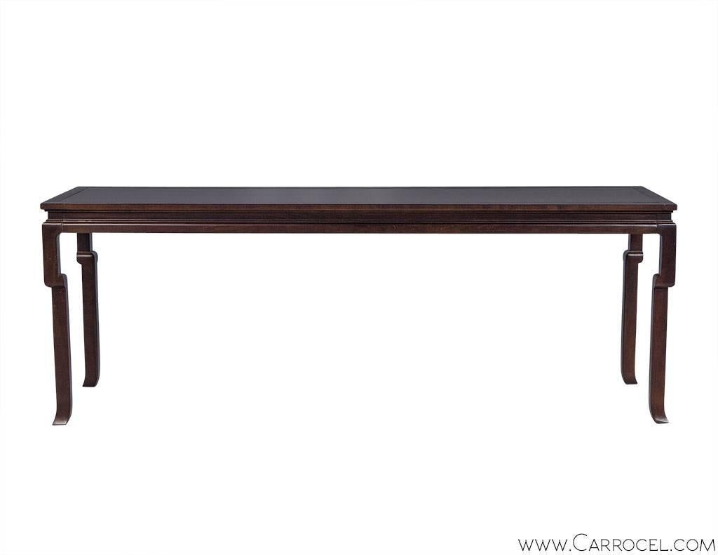 The Hickory Chair Atelier Ceylon Console Table has been inspired by a traditional Chinese altar table.  The long top and irregularly shaped legs have been crafted in solid maple, finished with a dark walnut hand rubbed polish.