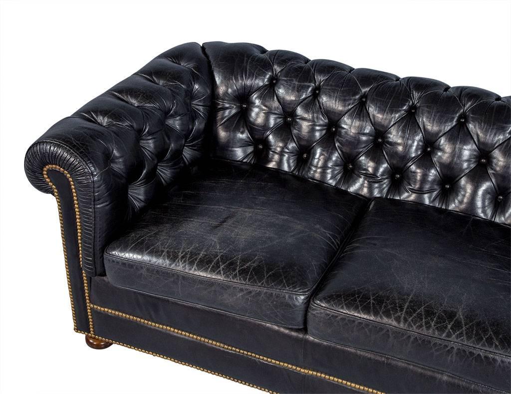 distressed black leather sofa