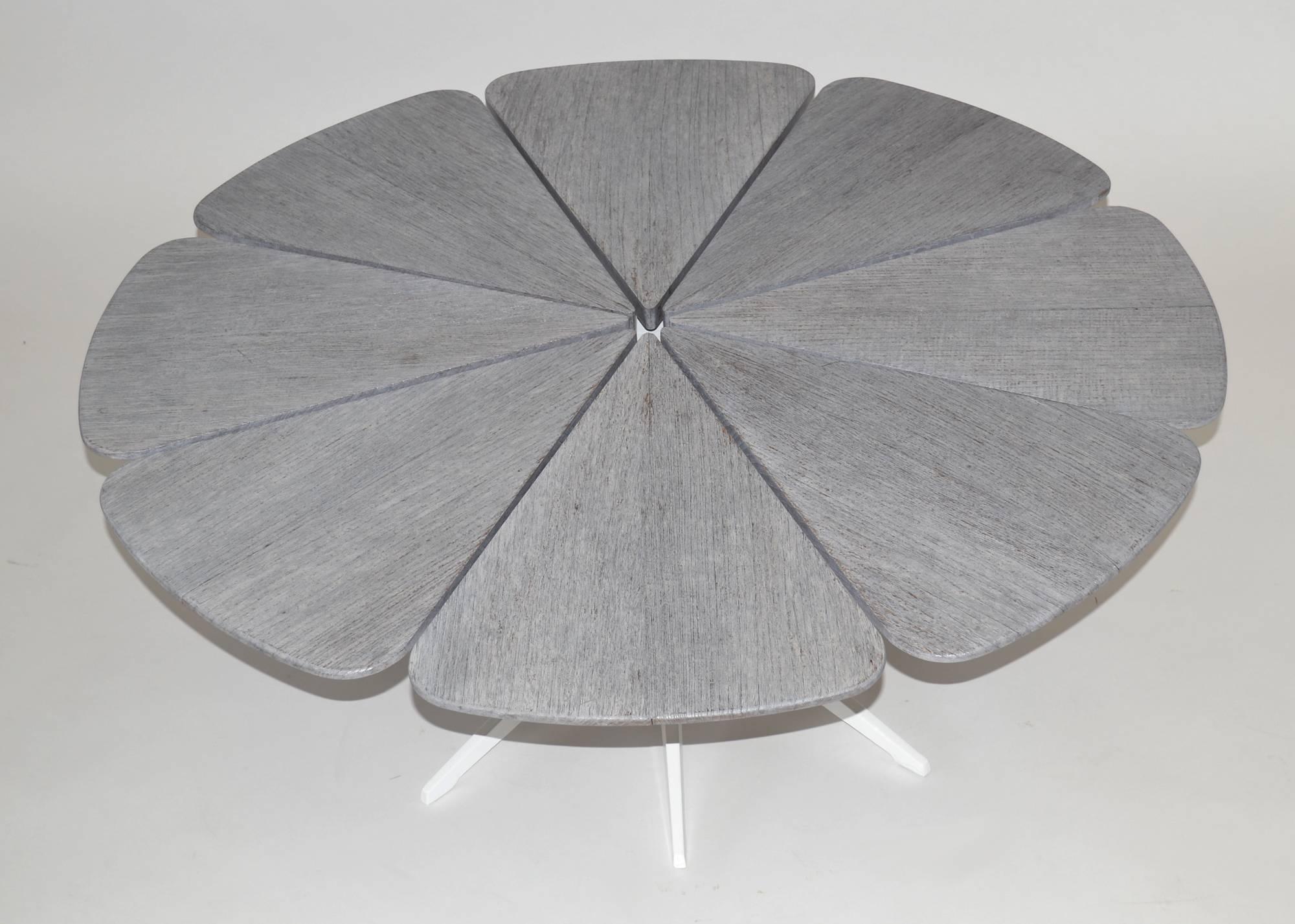 1990s edition of Richard Schultz for Knoll indoor or outdoor petal table in custom-distressed teak top with white powder-coated cast aluminium base.