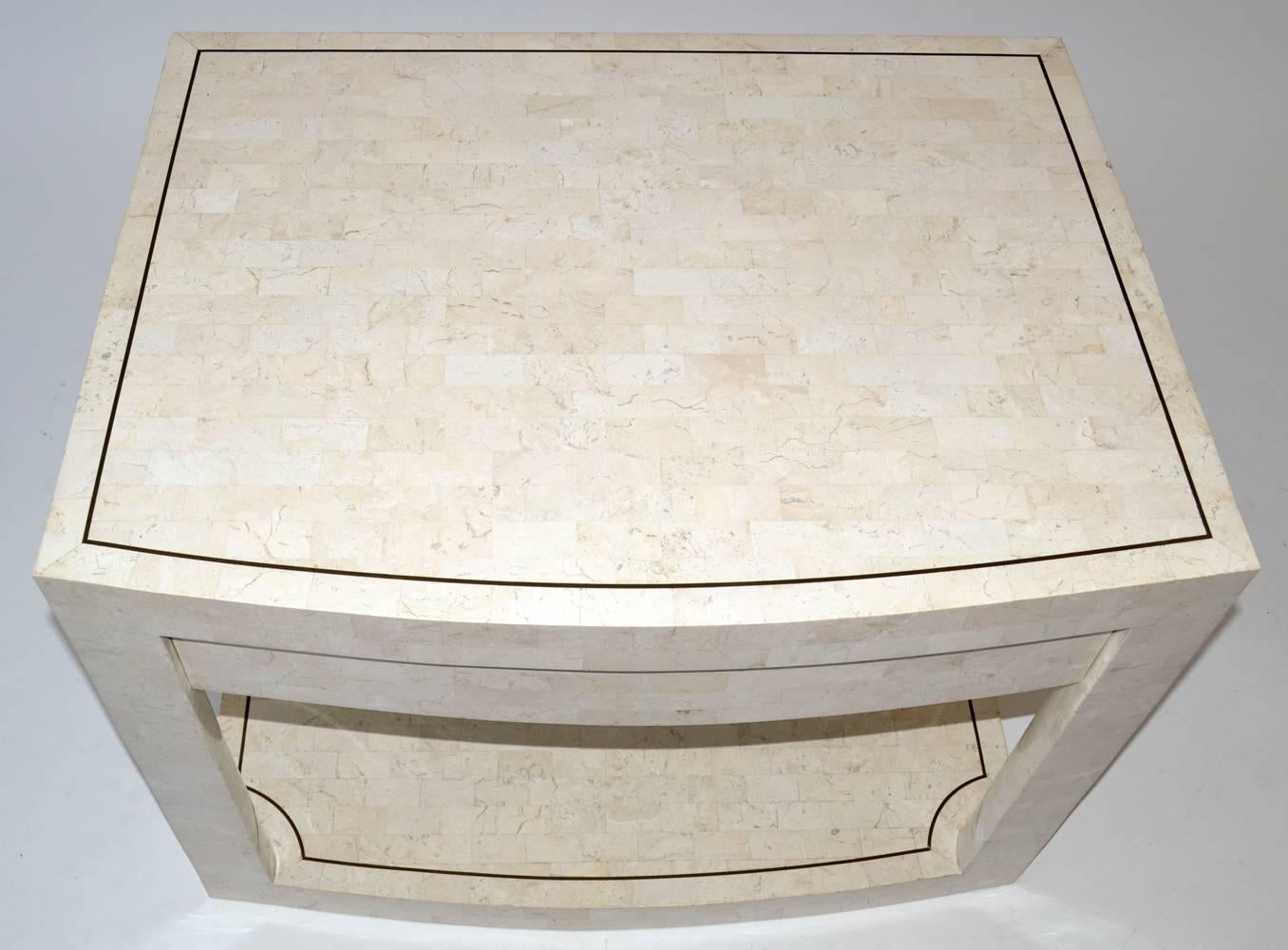 Karl Springer Side or End Table in Tessellated Stone Signed 
Two-Tier Table with Drawer signed Karl Springer. Gorgeous, seldom-seen two-tier table in tessellated stone with brass inlays. Karl Springer label in single mahogany drawer, American,