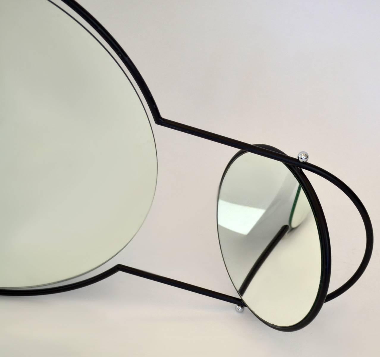 Modernist wall mirror by Rodney Kinsman for Bieffeplast, Italy, 1980s. Two-piece swivel double mirror in black iron frame which can be hung vertically or horizontally. Minimalist functional design. Labeled.