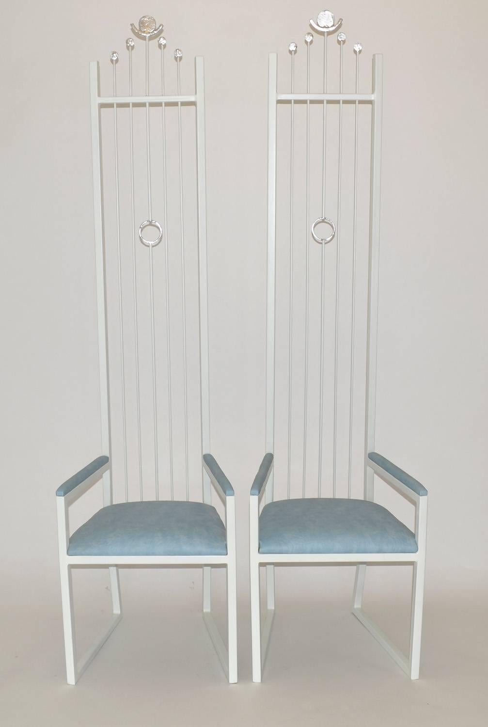 Surrealist set of four tall dining chairs after atelier Jean Royère, France, 1980s. Completely restored sculptural metal in Glacier White lacquer, with cushions and armrests upholstered in blue/white cloud-tone leatherette. Truly a unique Fantasy