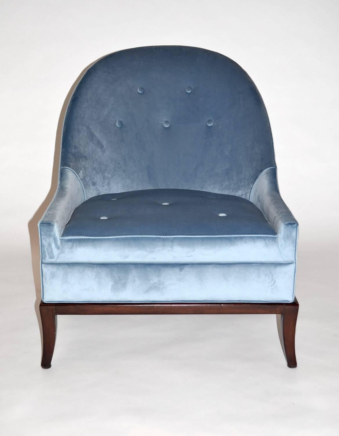 Pair of rare slipper or lounge chairs by T.H. Robsjohn-Gibbings for Widdicomb. Beautiful pair of model 2043 slipper or lounge chairs on dark walnut base newly upholstered in crushed blue velvet.