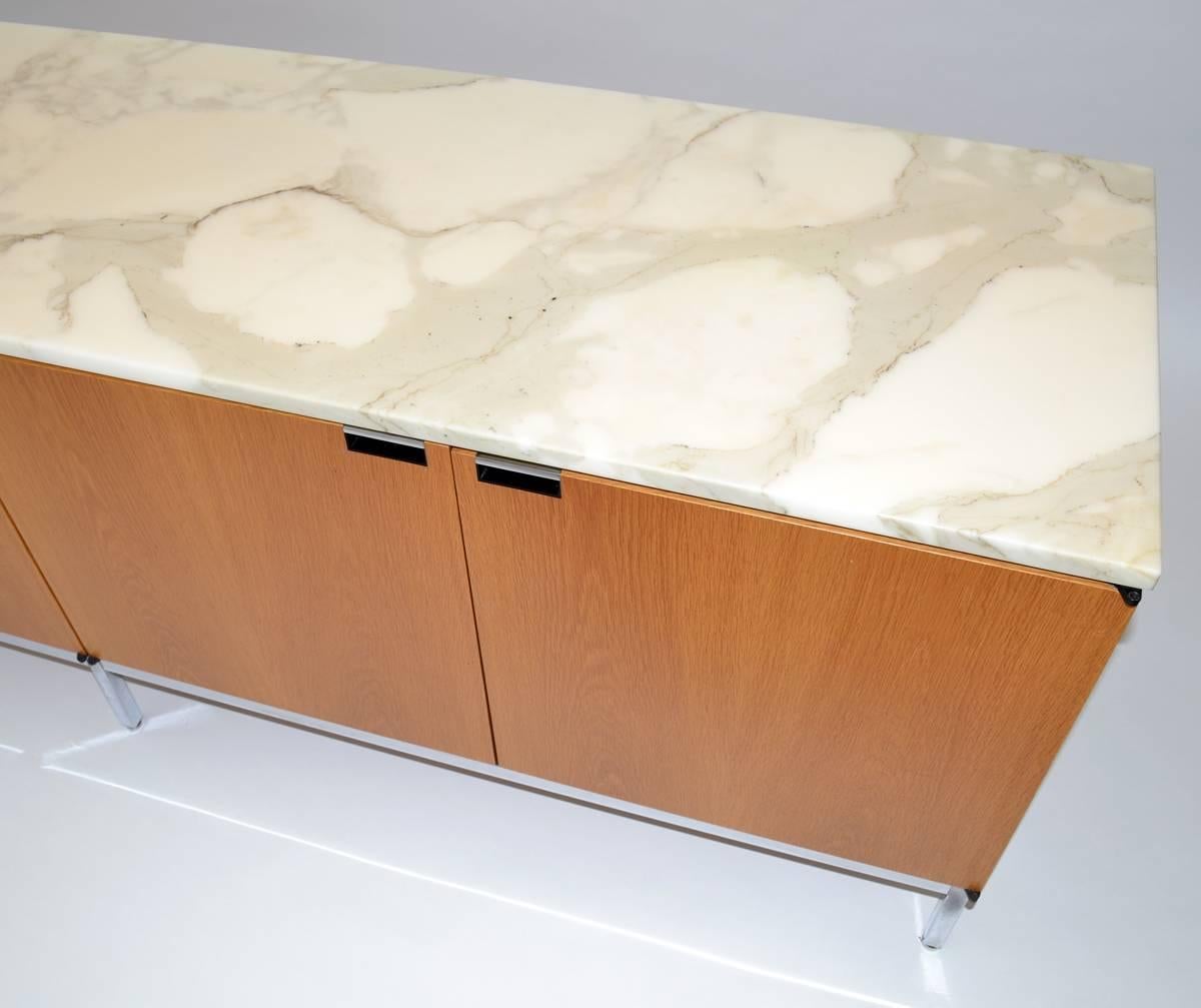 Four-door Buffet by Knoll in Oak case on chrome legs, with beautiful Calcutta marble slab surface.LABELED