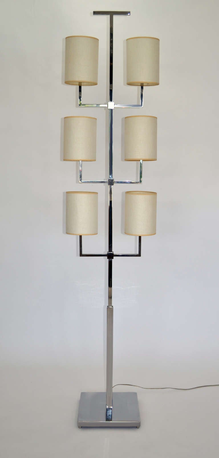 Rare floor lamp by Tommi Parzinger for Lightolier. Six-arm, nickel-plated steel, trident-style with original shades. 1960s limited production in fantastic condition.