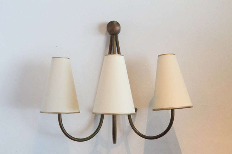 A pair of Jean Royère sconces in gilded metal.
Sold only as a pair.