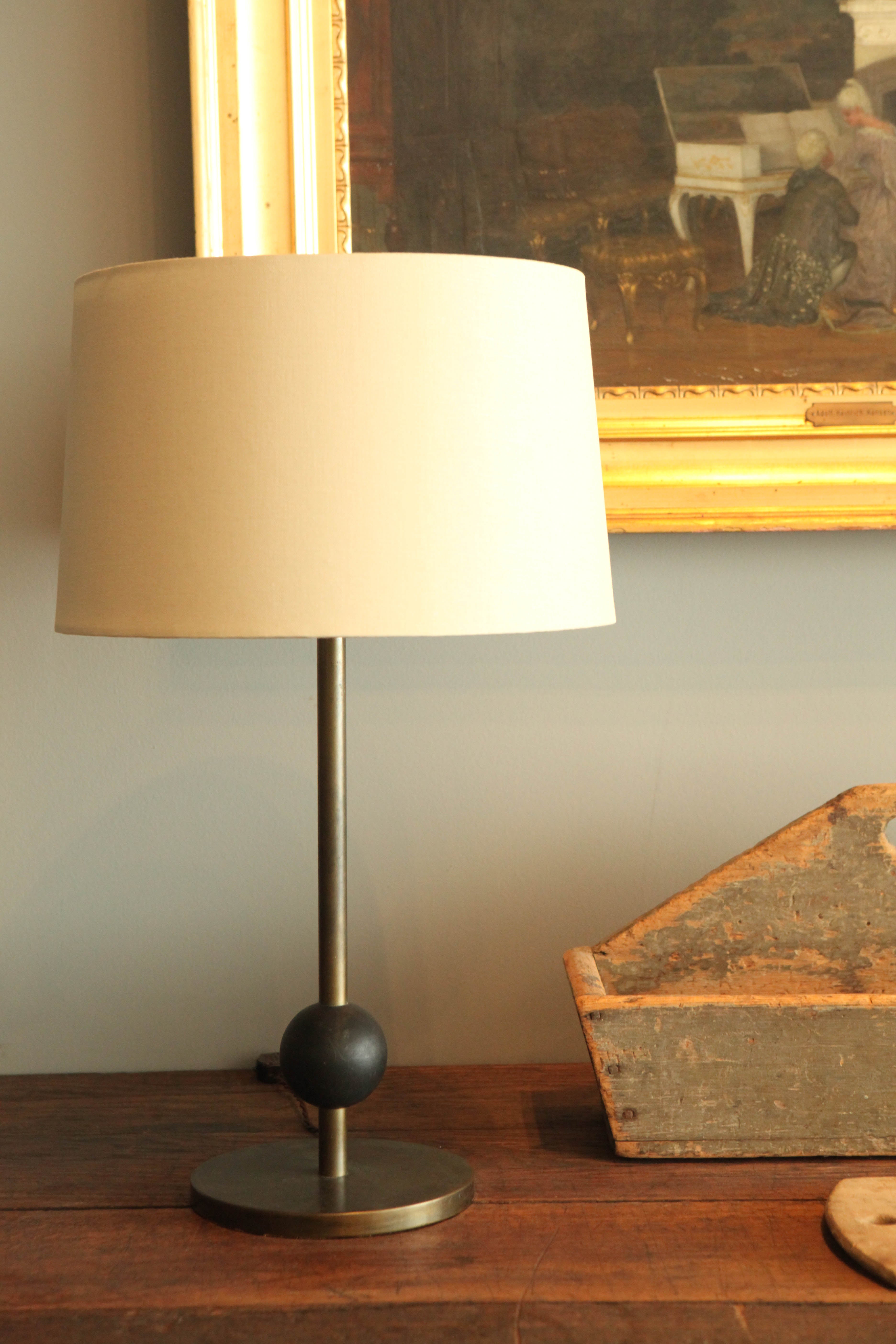 A beautifully handsome and simply designed table lamp.
Shade in linen new to piece.