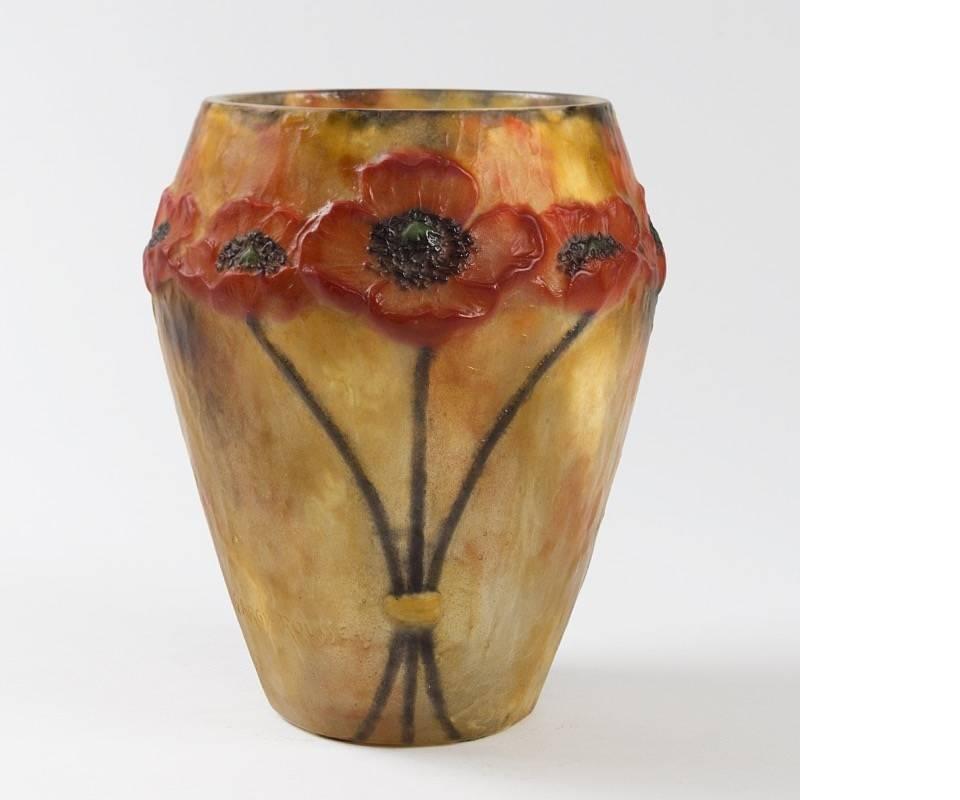 A French “Coquelicots” pâte de verre vase by Gabriel Argy-Rousseau. Nature, particularly flowers was one of Argy-Rousseau's most inspiring subject matter. In this vase, depicting red poppy flowers against an orange background, the artists confirm
