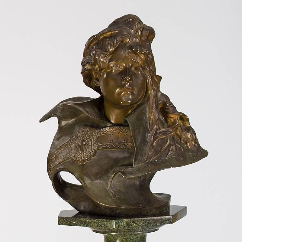 This gilt and patinated bronze French Art Nouveau sculpture portrait depicts famed actress Sarah Bernhardt, by Paul-François Berthoud. Berhnardt, one of the most important actresses of her day, is frozen, here, in a stance and expression of great