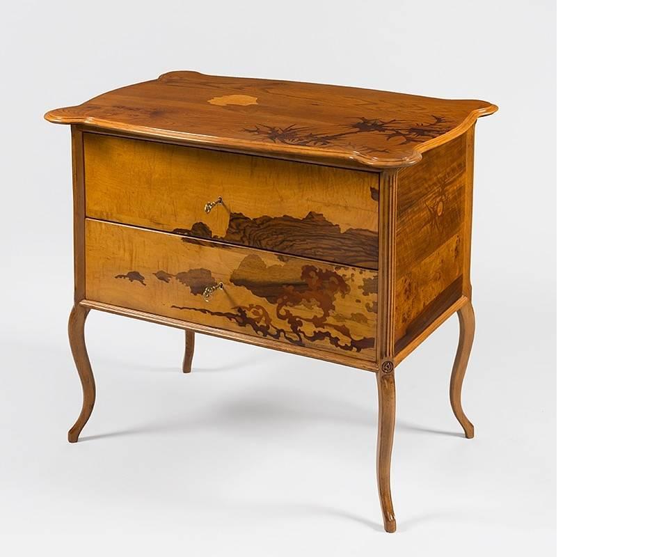 A French Art Nouveau marquetry commode by Émile Gallé. With original key.  Circa 1890.

The syncretic influence of Japanese art is keenly felt in Gallé's commode. The beginning of Galle's fascination with Japanese art can be traced back to his