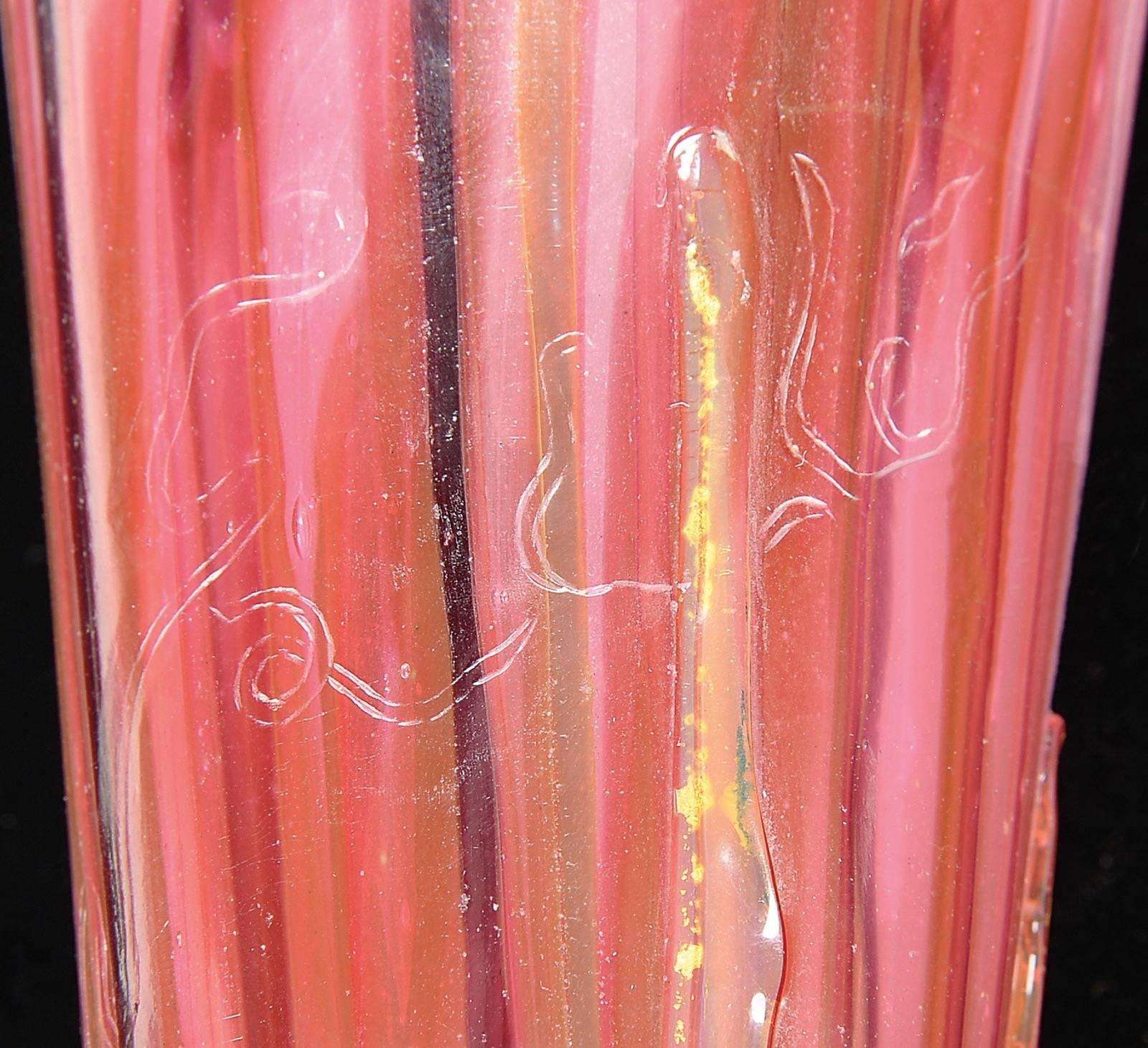 A marquetry glass vase by Émile Gallé, this unique piece features a delicate, nearly translucent arrangement of crocus flowers in hues of orange and purple, against a soft, milky, cream-colored background. The French Art Nouveau vase's composition