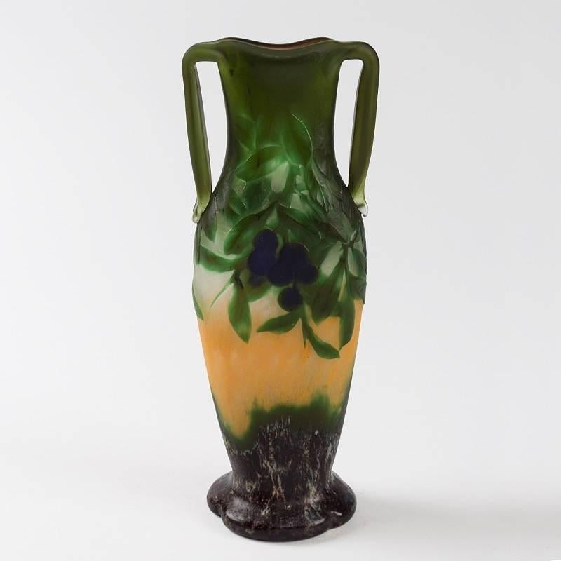 French wheel carved cameo glass vase with applied handles by Daum, circa 1910.

Two vases with similar decoration are pictured in: Daum Nancy: Maîtres Verriers, by Katharina Büttiker, Zurich: Galerie Katharina Büttiker, 2001, cat. no.