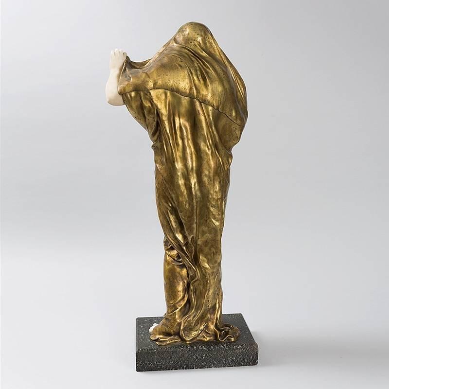 A French Art Nouveau gilt bronze, alabaster, marble, and lapis lazuli sculpture by Louis-Ernest Barrias titled “Nature Revealing Herself Before Science”. 

A similar sculpture is pictured in: Art Nouveau Sculpture, by Alastair Duncan, New York: