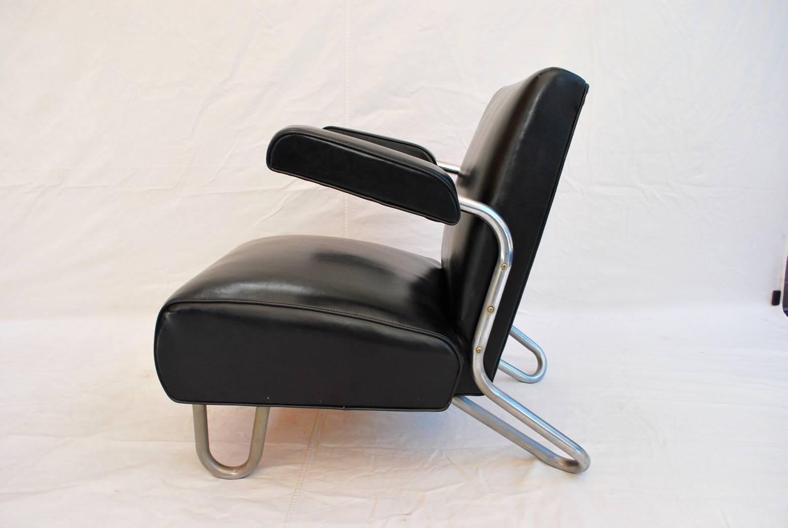 a beautiful and sexy 1940 KEM WEBER chair, this chair is very unique, the arms rest were designed for a specific reason,  once you are seating  in the chair, you could move your legs either on the left or on the right side , and speak to somebody