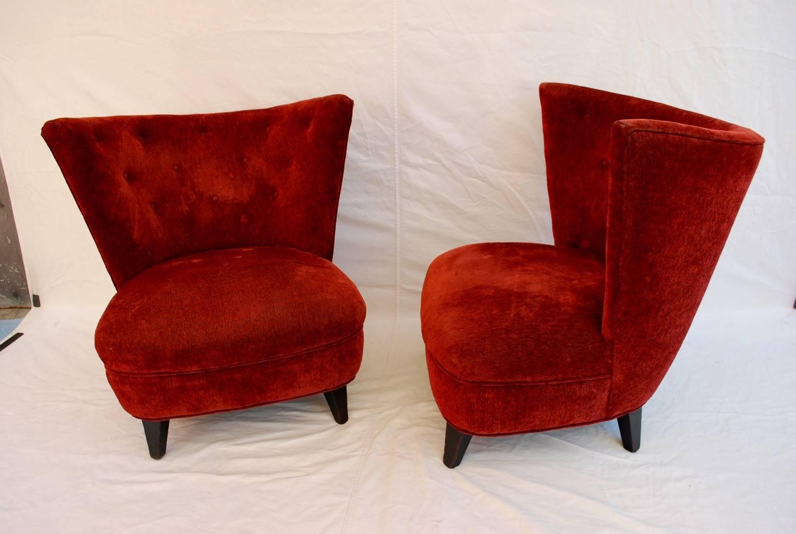 An elegant pair of lounge chairs by the iconic designer Gilbert Rohde, the color of the velvet is much more beautiful in person, it has a deep burgundy color.