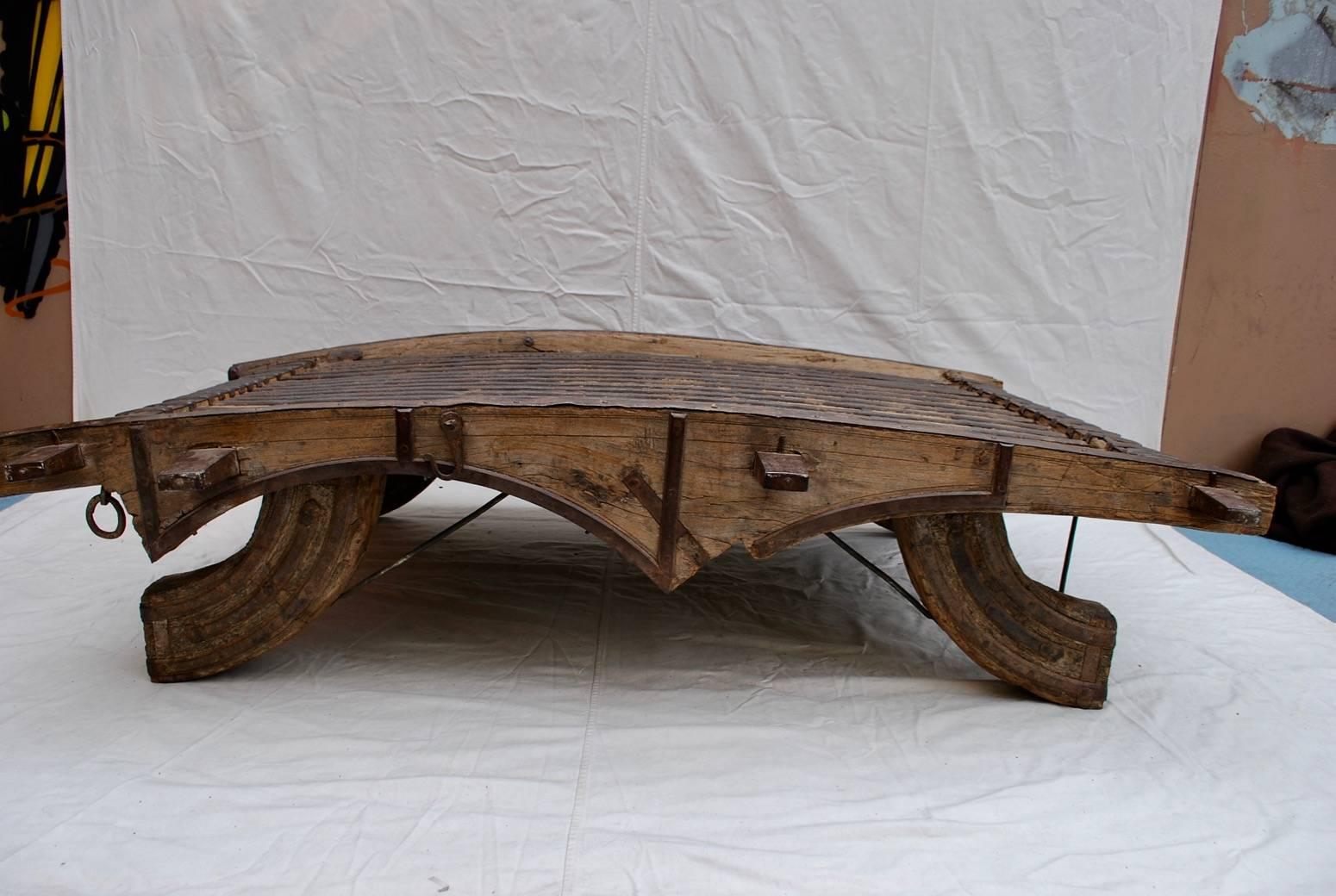 What a beautiful coffee table, made with teak wood, so it could be indoor or outdoor, it is quit heavy over 250 pounds, it was my coffee table for many years, this table can go with so many different style, I believe originally it was an docking