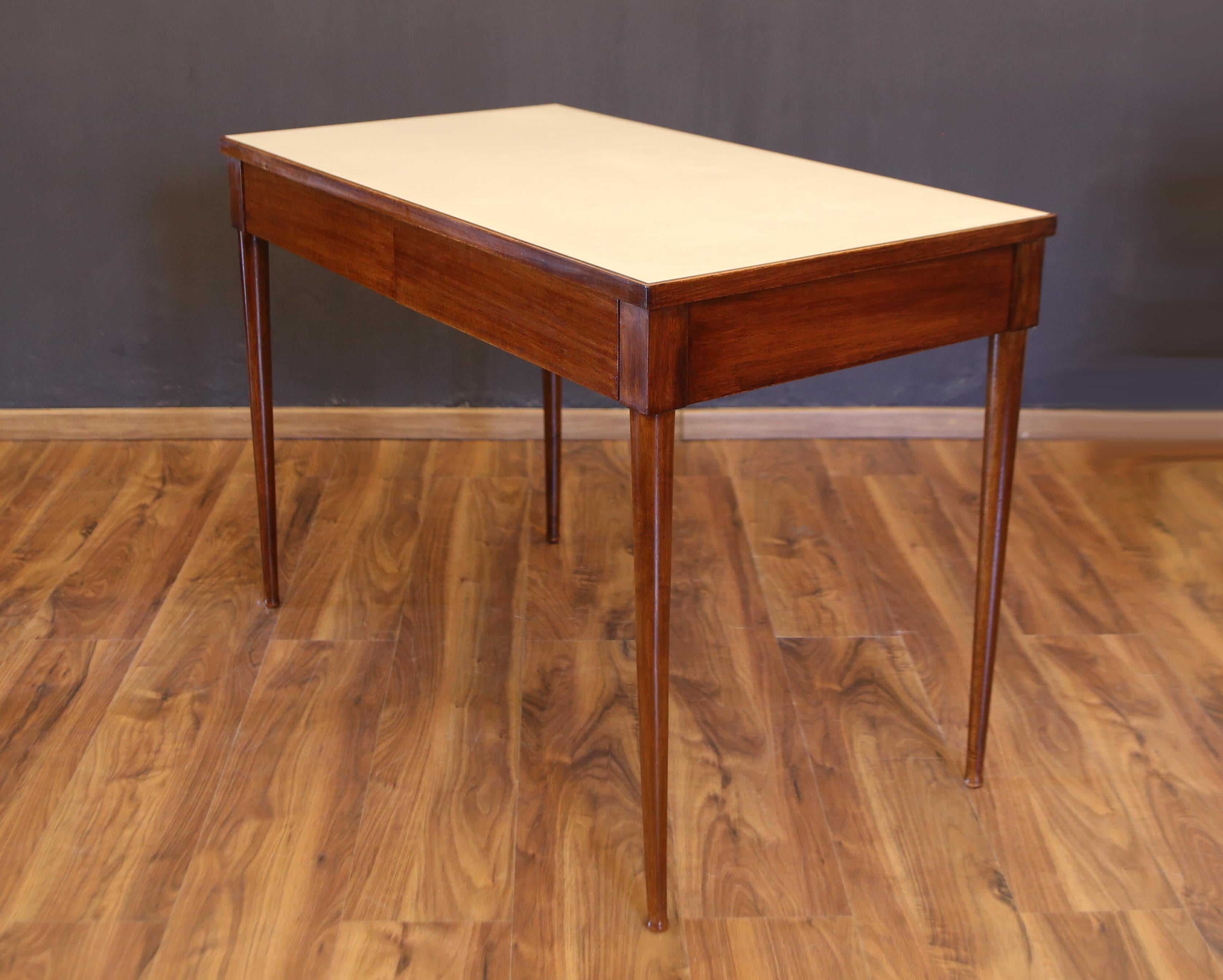 late 1940s desk by Gio Ponti in walnut wood and formica top.
this desk was made for a house in milan, designed by gio ponti and emilio lancia.