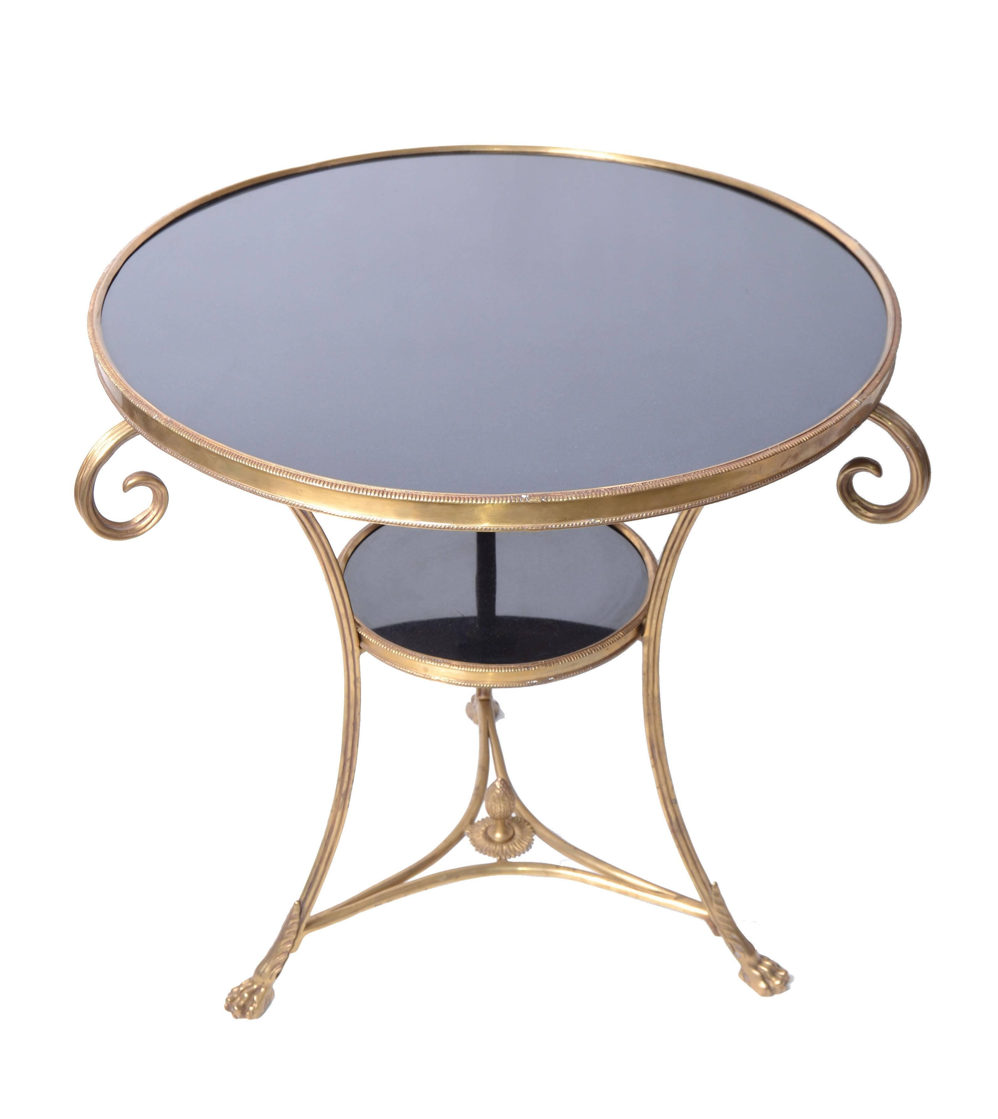 Decorative French brass and marble coffee table / side table with claw feet.
Heavy marble tops in black and well crafted brass details.