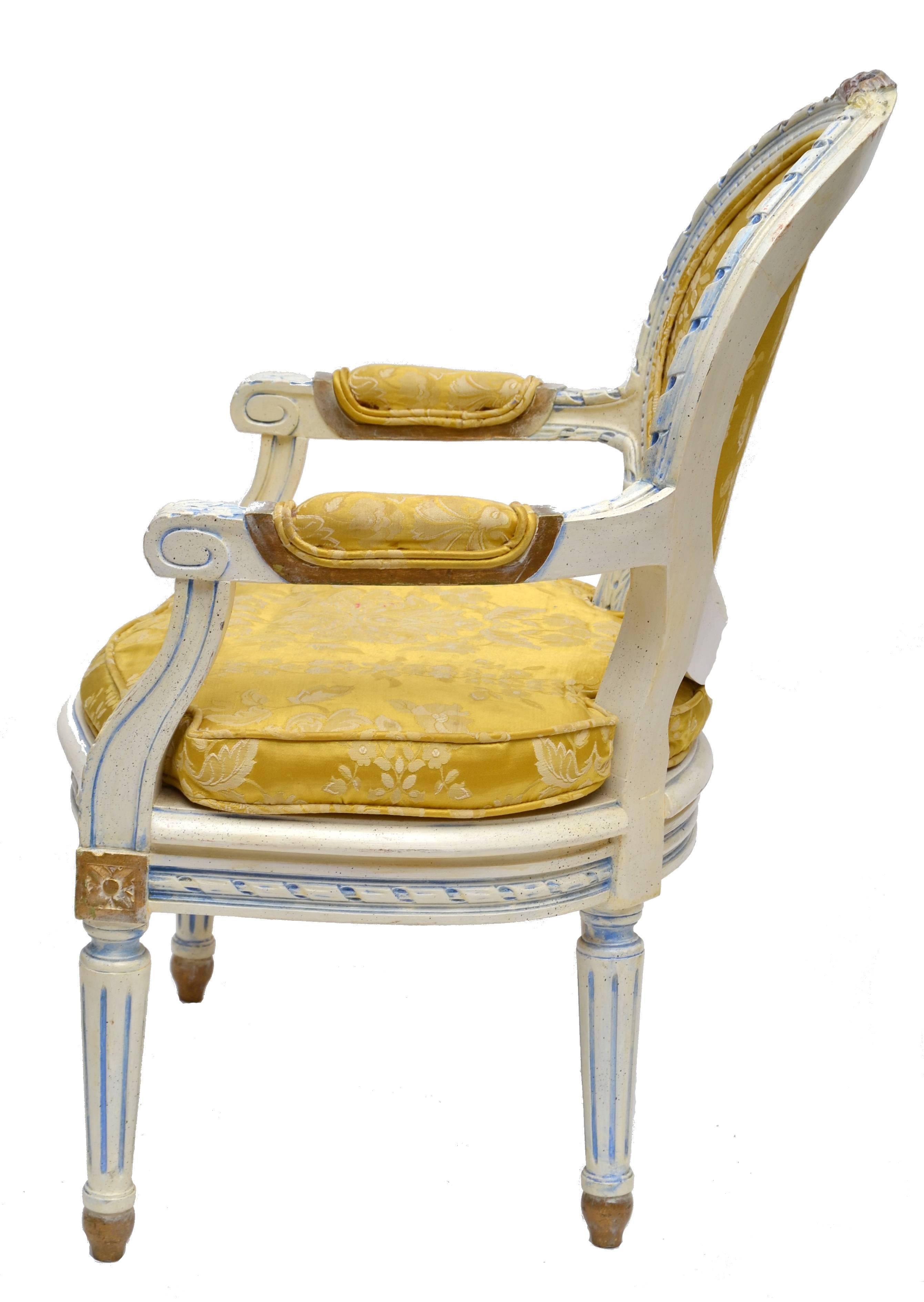 Cute French Louis XVI style children armchair.
The oval backs having foliate carved crests, over scrolled arms, rope twist carving, standing on turned, fluted and stop fluted legs standing on turned turnip feet.
The golden upholstery is a great