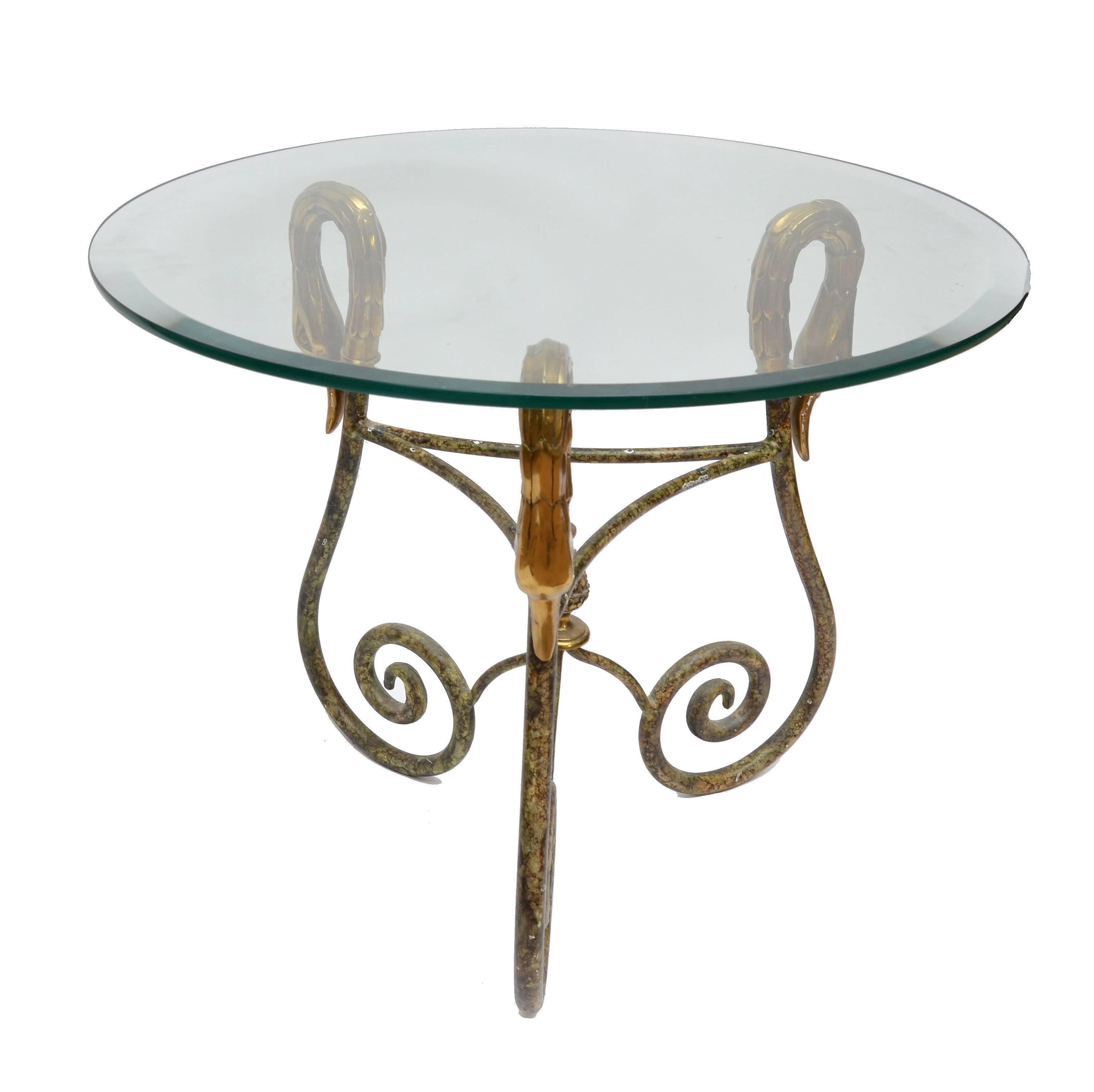 1950s Hollywod Regency spectacular round Italian side table with brass swan heads and acorns embedded in a wrought iron core.
The glass top is beveled.
Very impressive and decorative as well with great craftsmanship.
Dimension:
Base: 18 inches x 18