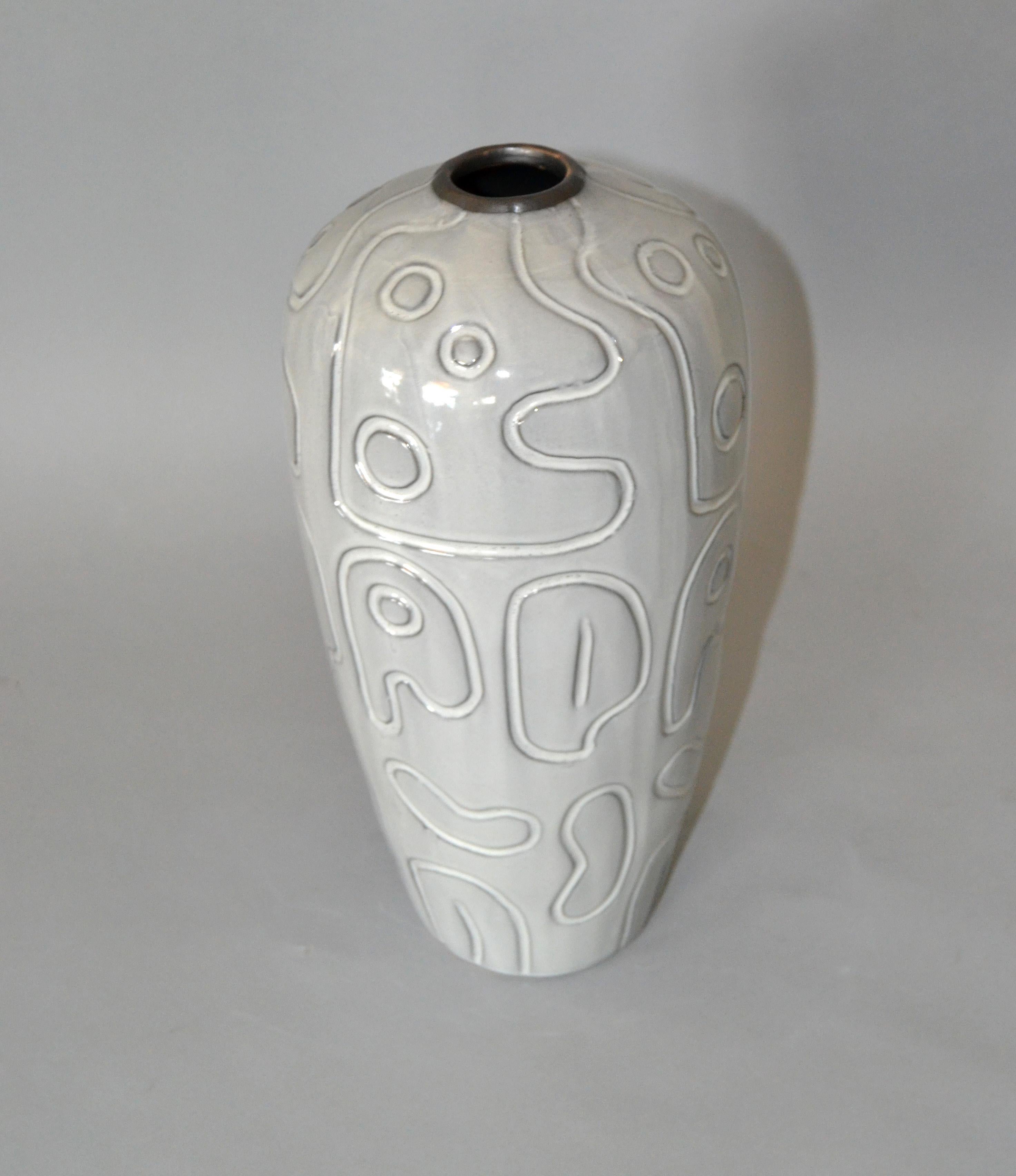 Charming modern glazed pottery vase in gray.
It is a studio piece and has no markings.