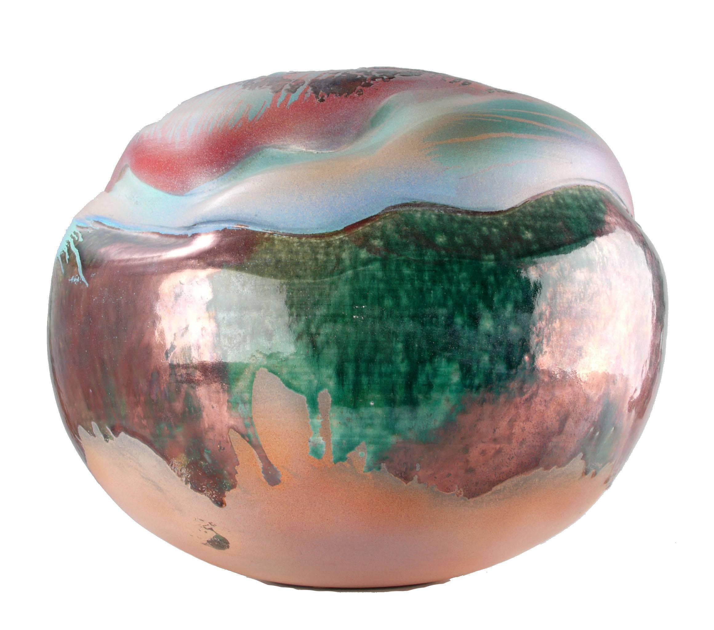 Mid-Century Modern large spherical drip glazed art pottery in green, white and pink.
Finish is wavy, matte and shiny. Hollow inside. Excellent condition.
No Markings.
 