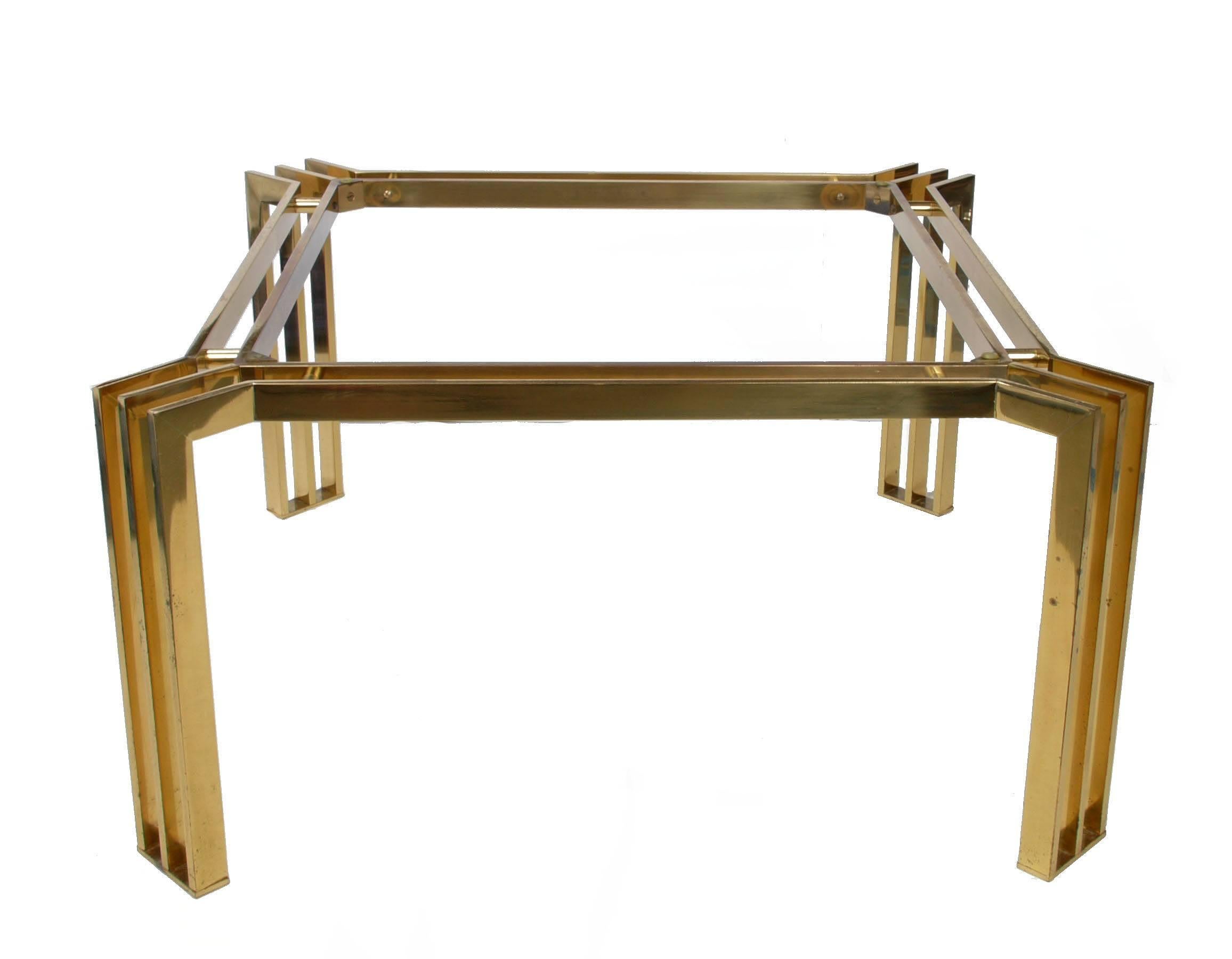 Square Italian brass coffee table with brass spacers.
Marked underneath: 