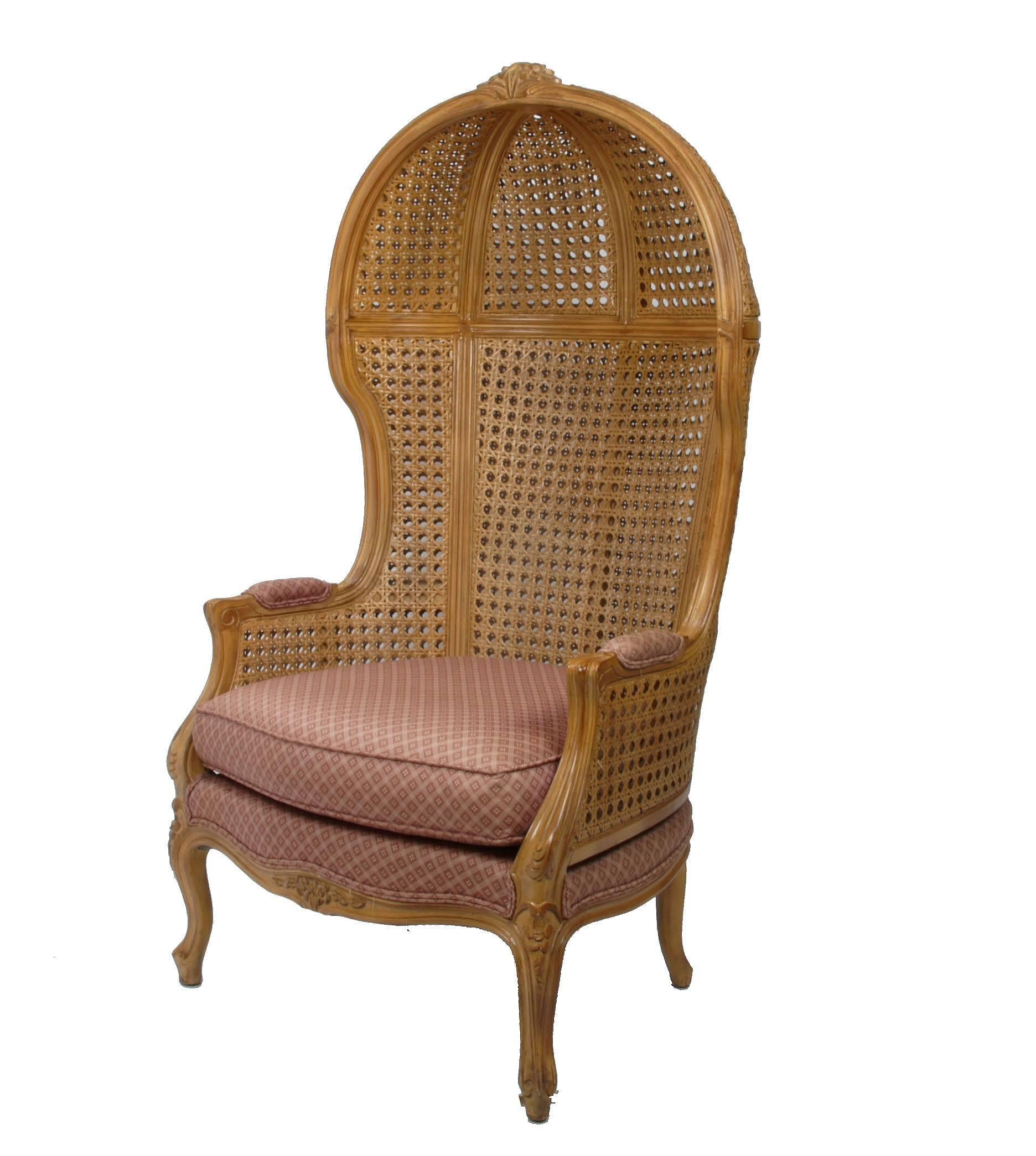 Hand-carved rattan and cane high-back hooded chair.
Marked Avanti Furniture Company under seat cushion.
Seat Height: 18.5 inches,  Arm Height: 24 inches.