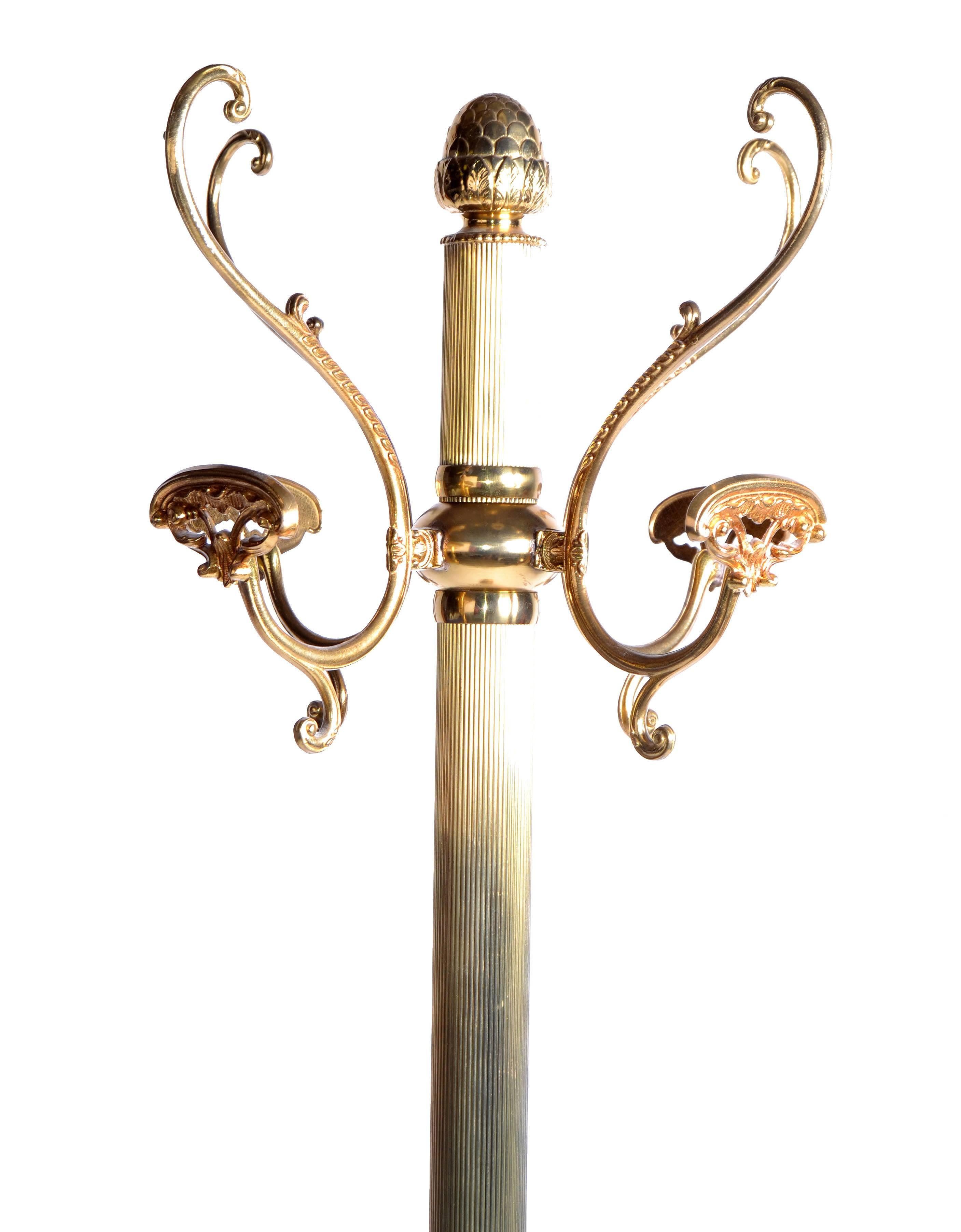Solid brass coat stand with decorative details as acorn, leaves, special hat hooks. Overall a masterpiece of craftsmanship. No markings.