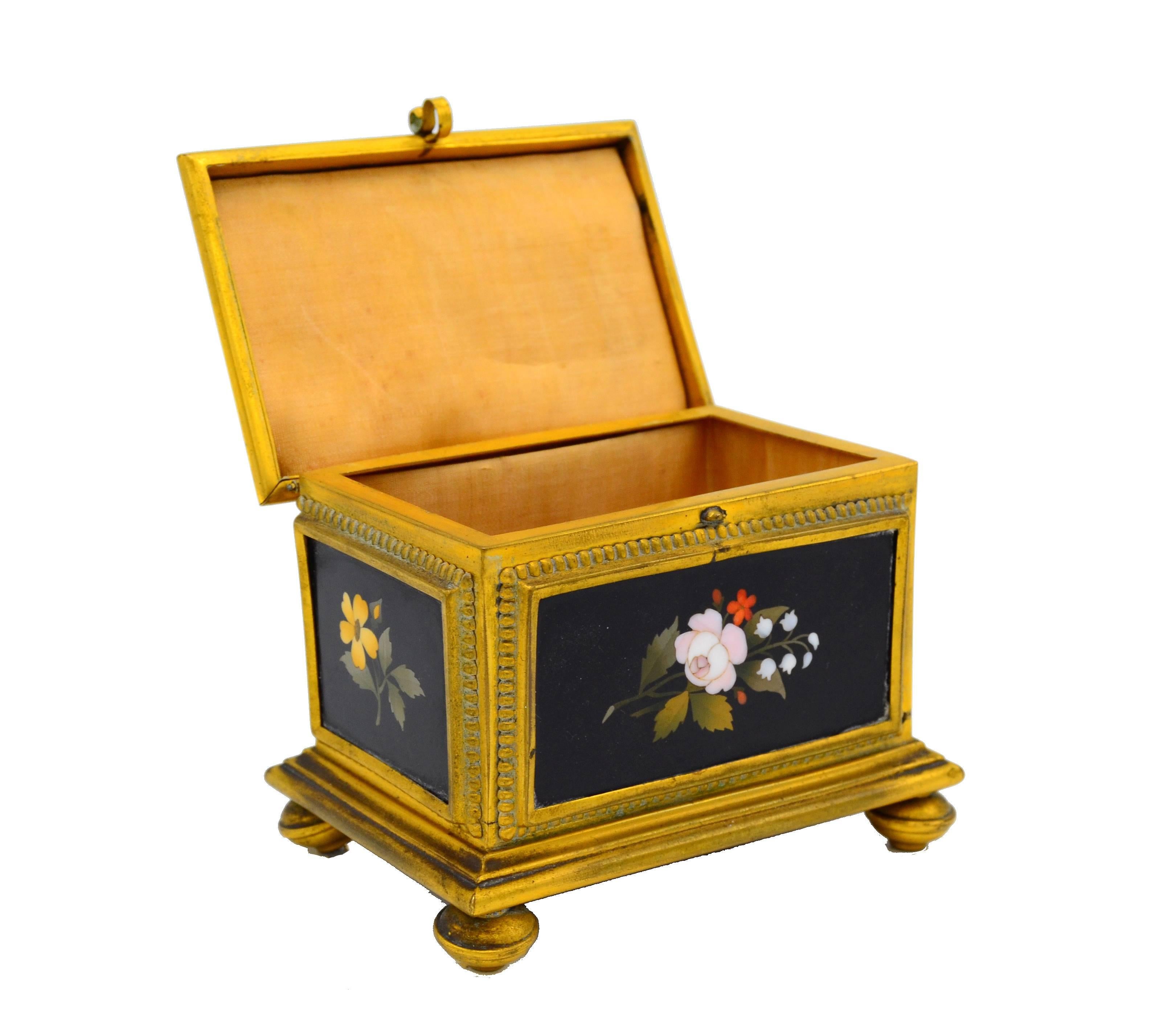 Very finely detailed ormolu bronze box frame with five Pietra Dura Stone marquetry panels.
Interior has original silk lining. Not marked and attributed to Pietra Dura.
  