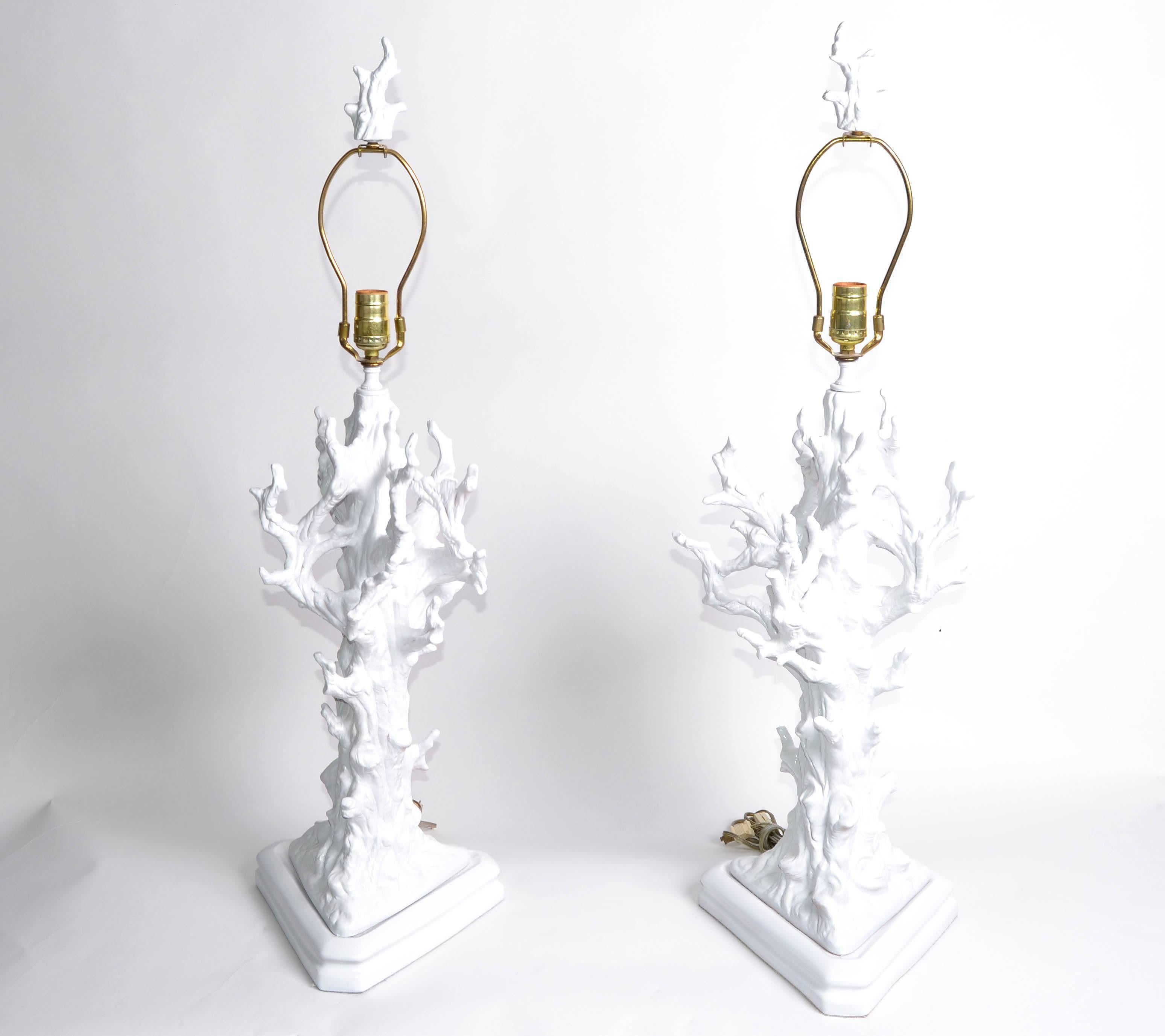 White porcelain tree branches table lamps with matching finials.
In perfect working condition and each lamp uses a 60 wattage light bulb.
Lampshades not included.
Measures: Height to top of socket: 26.5 inches.
