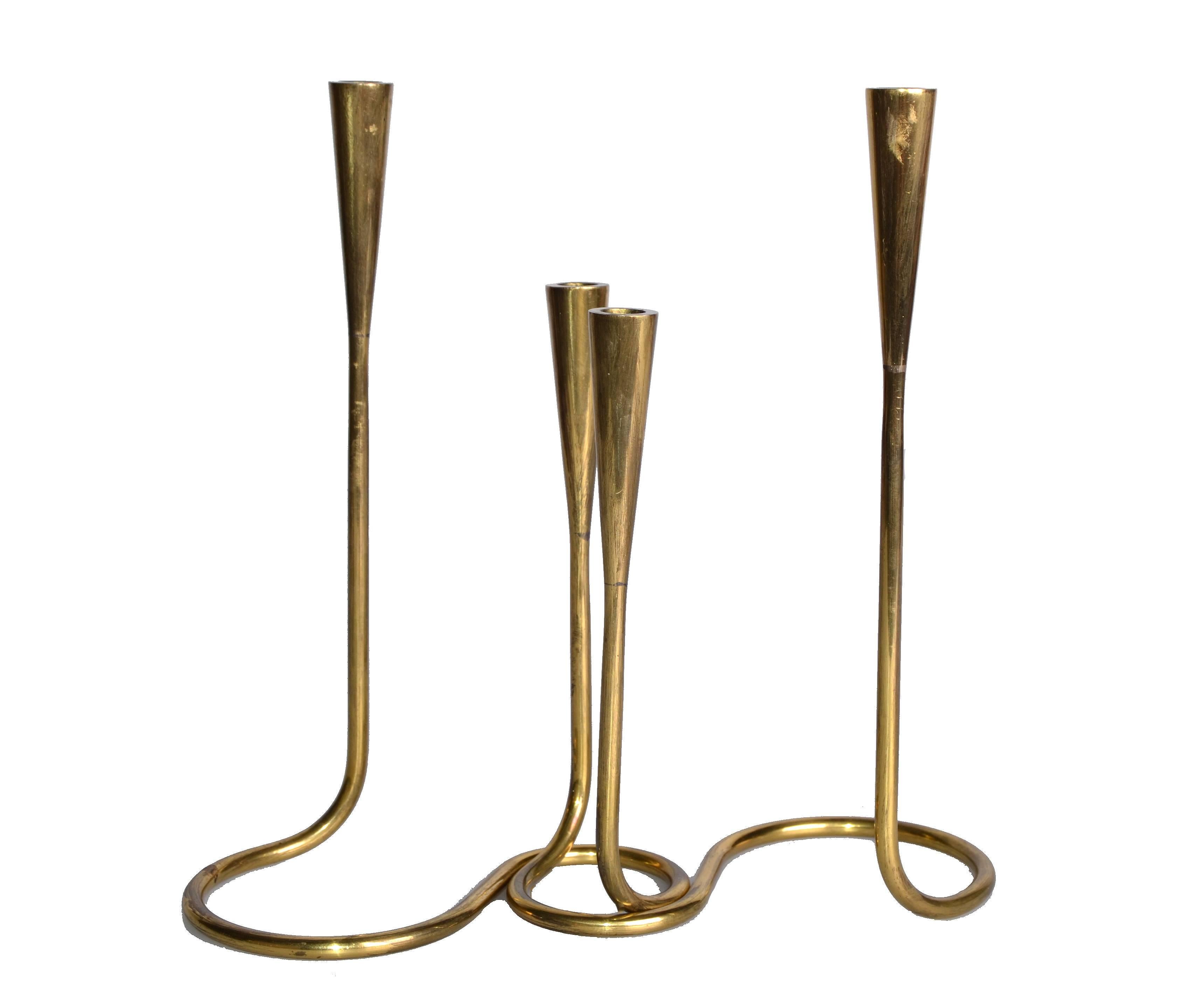 A pair of brass serpentine double candlesticks by Illums Bolighus.
The pair can be intertwined or arranged separately for table decoration.
Both are marked underneath.
Great Scandinavian craftsmanship.