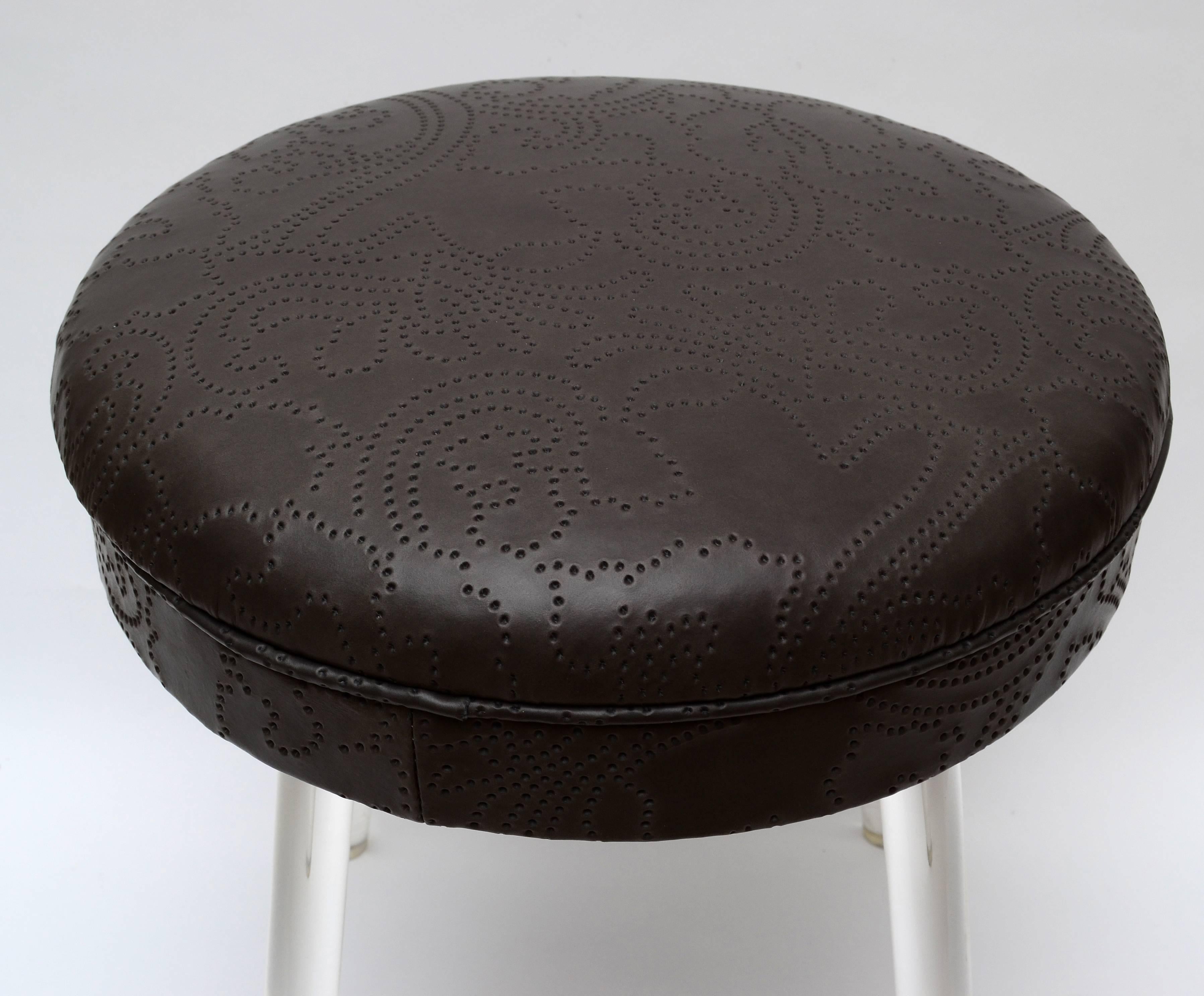 Mid-Century Modern Lucite stool with leather seat and swivel function.
The seat was recently upholstered in this soft leather with unique pattern.
Makers mark: Uni Level.

Measures: Seat height 17.0 inches.