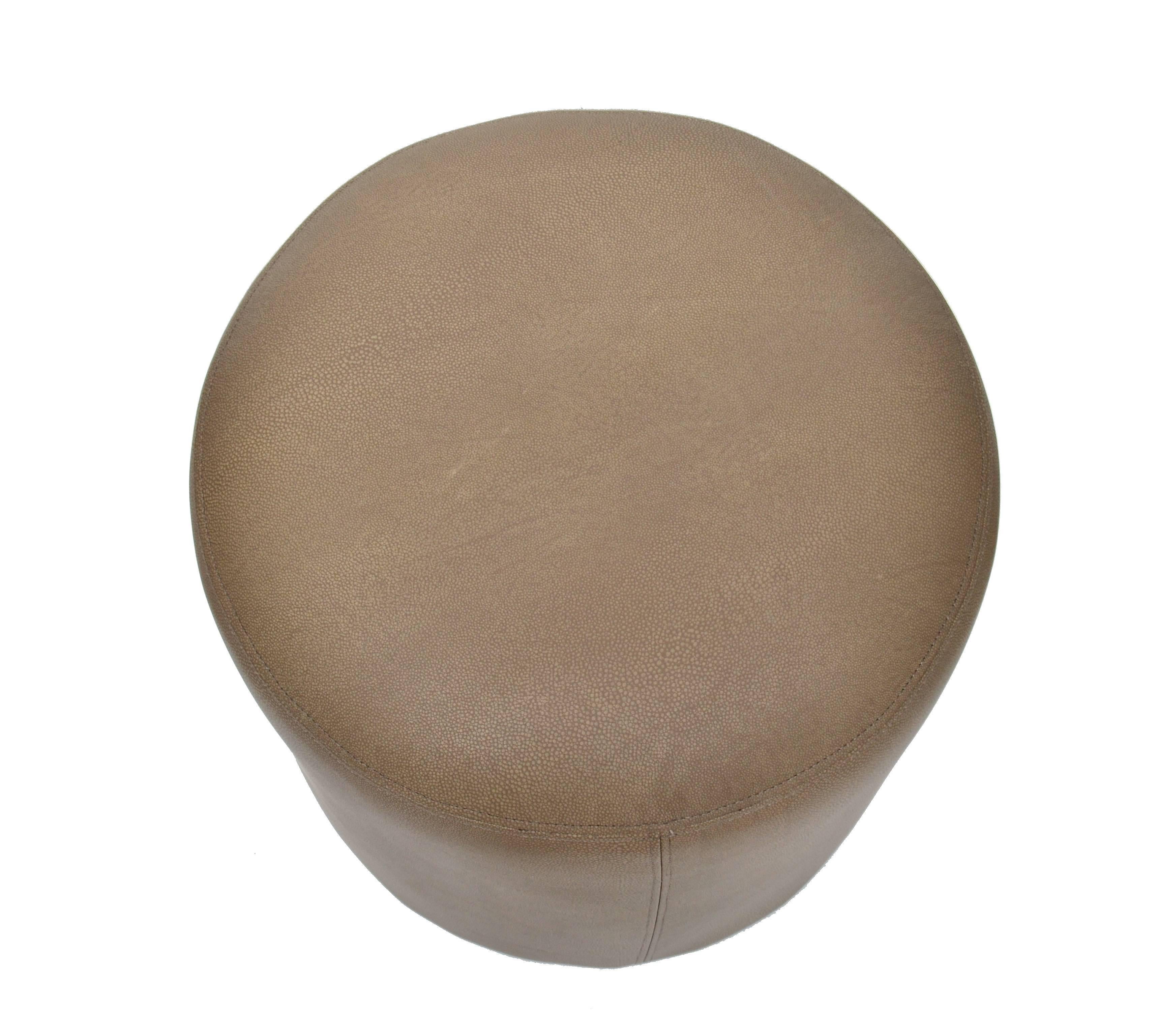 Modern round shagreen leather ottoman.
Can be used as footstool or as a pouf.
 