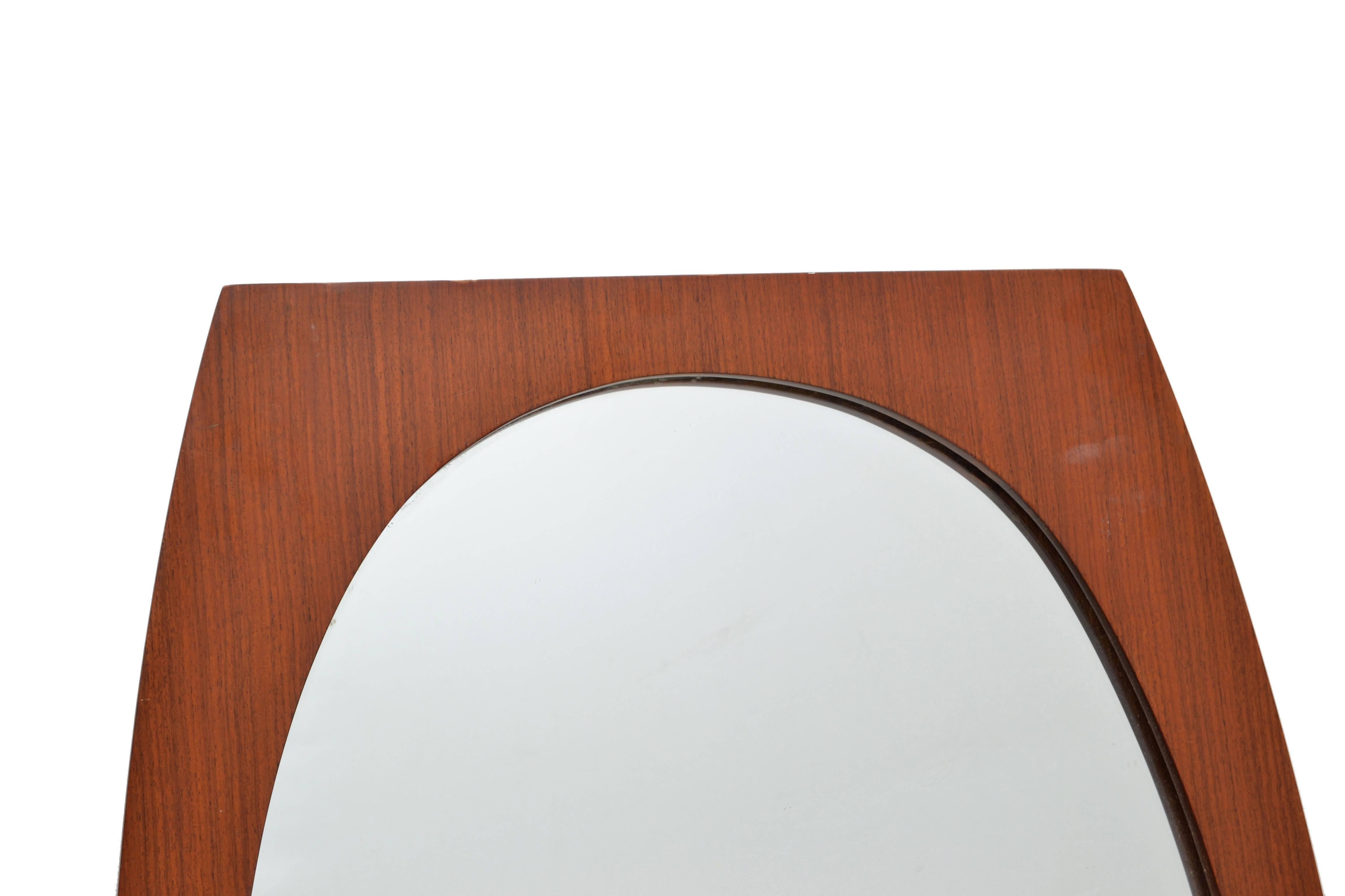 Scandinavian Modern Elliptical mirror set in a complementary walnut wood frame.
Mid-Century Modern Craftsmanship made in Denmark.
Can be hung securely only vertical.
Good vintage condition with normal wear due to History.