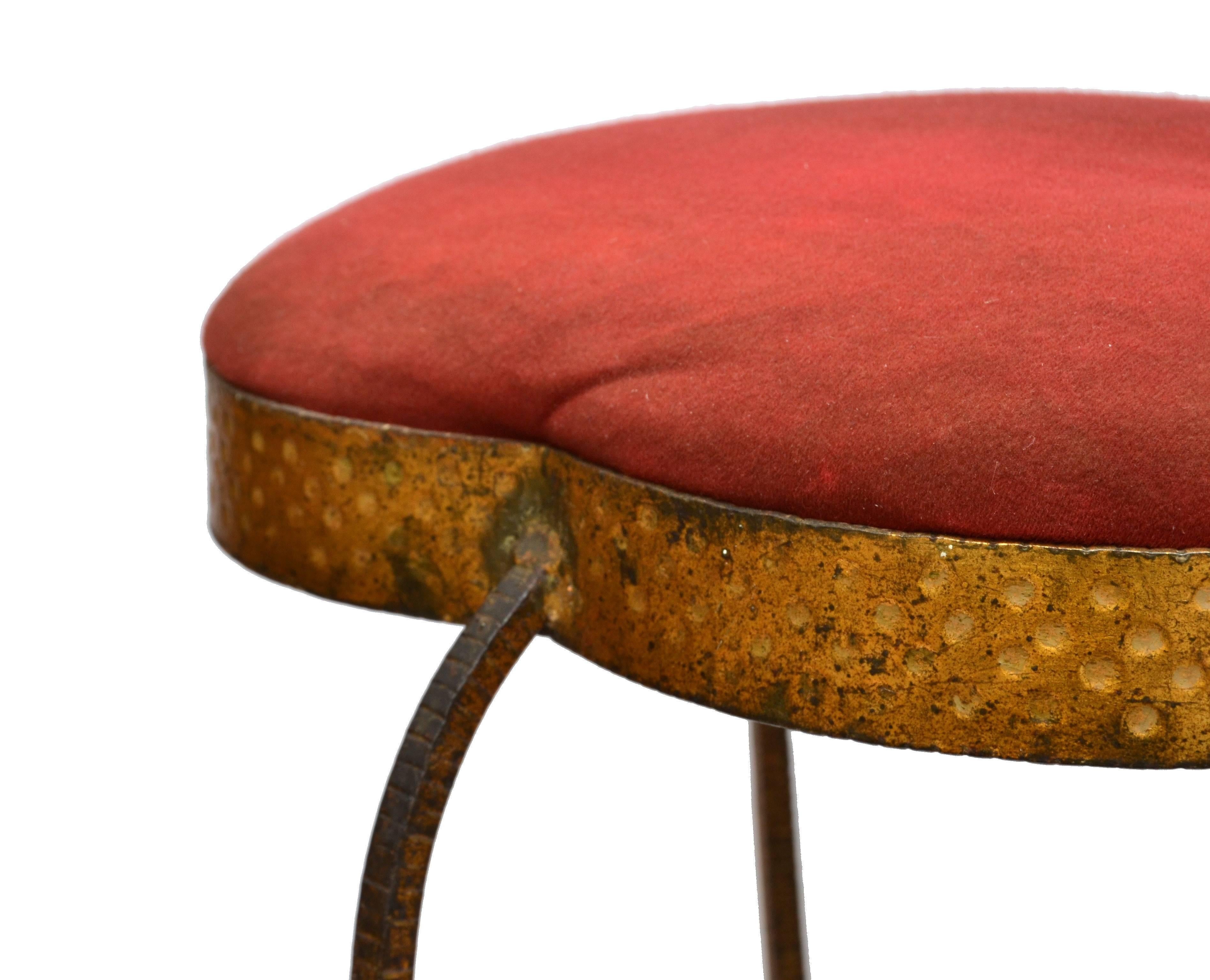 Graceful vanity stool made out of gold leaf hand hammered wrought iron with red upholstery by Pier Luigi Colli.
In original vintage condition.
We have also available in our other listings mirror, umbrella stand, consoles & chair.
 