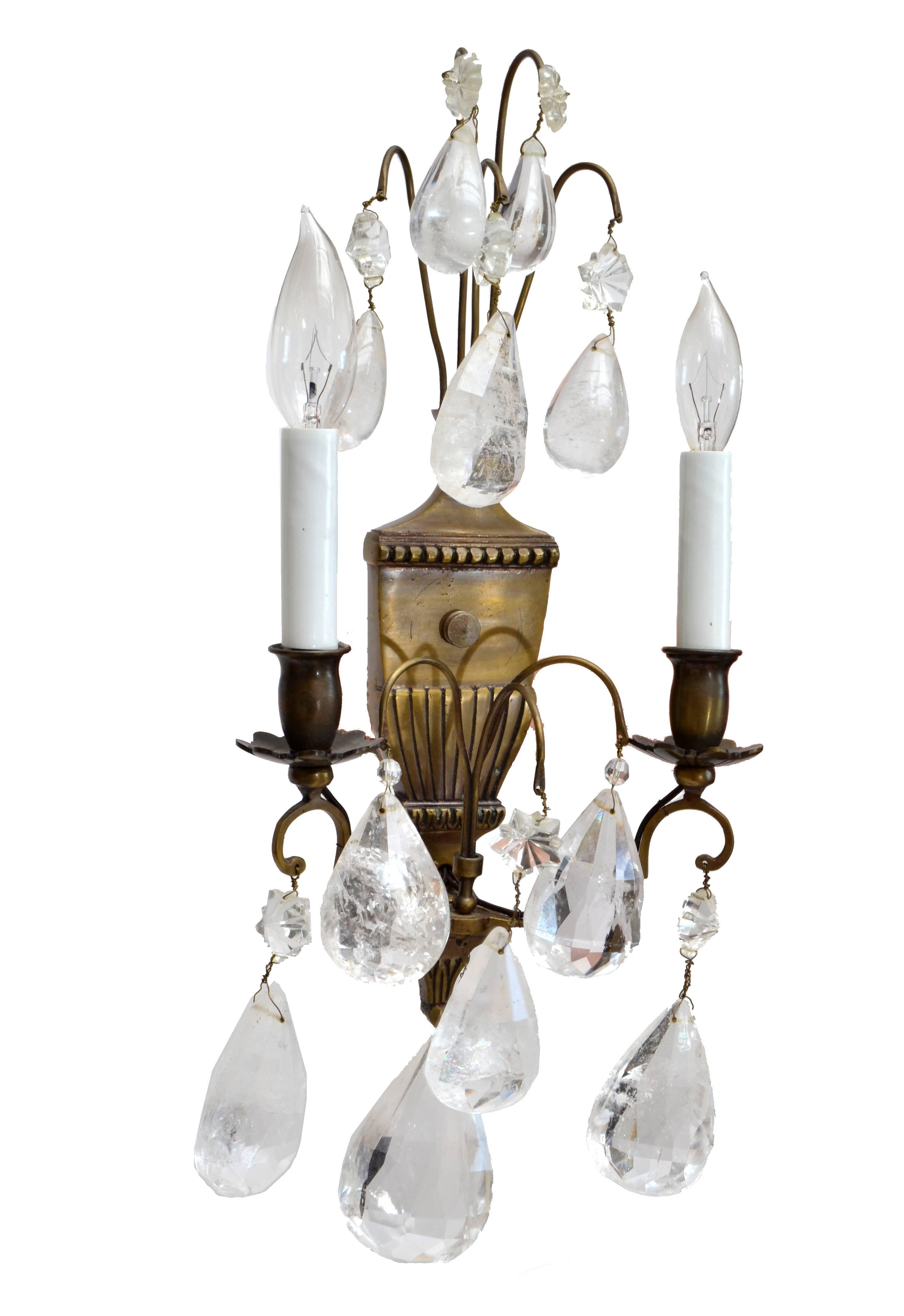 Bohemian rock crystal and bronze wall sconces, a pair.
Each wired for the U.S. and uses 2 max. 40 watts light bulbs.