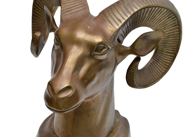 Hollywood Regency solid ram's head tabletop sculpture.
Well aged patina, can be polished to perfection.
   